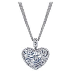 Stenzhorn 18 Karat Gold, Light Blue Sapphire Open Worked Puffed Heart Pendant
