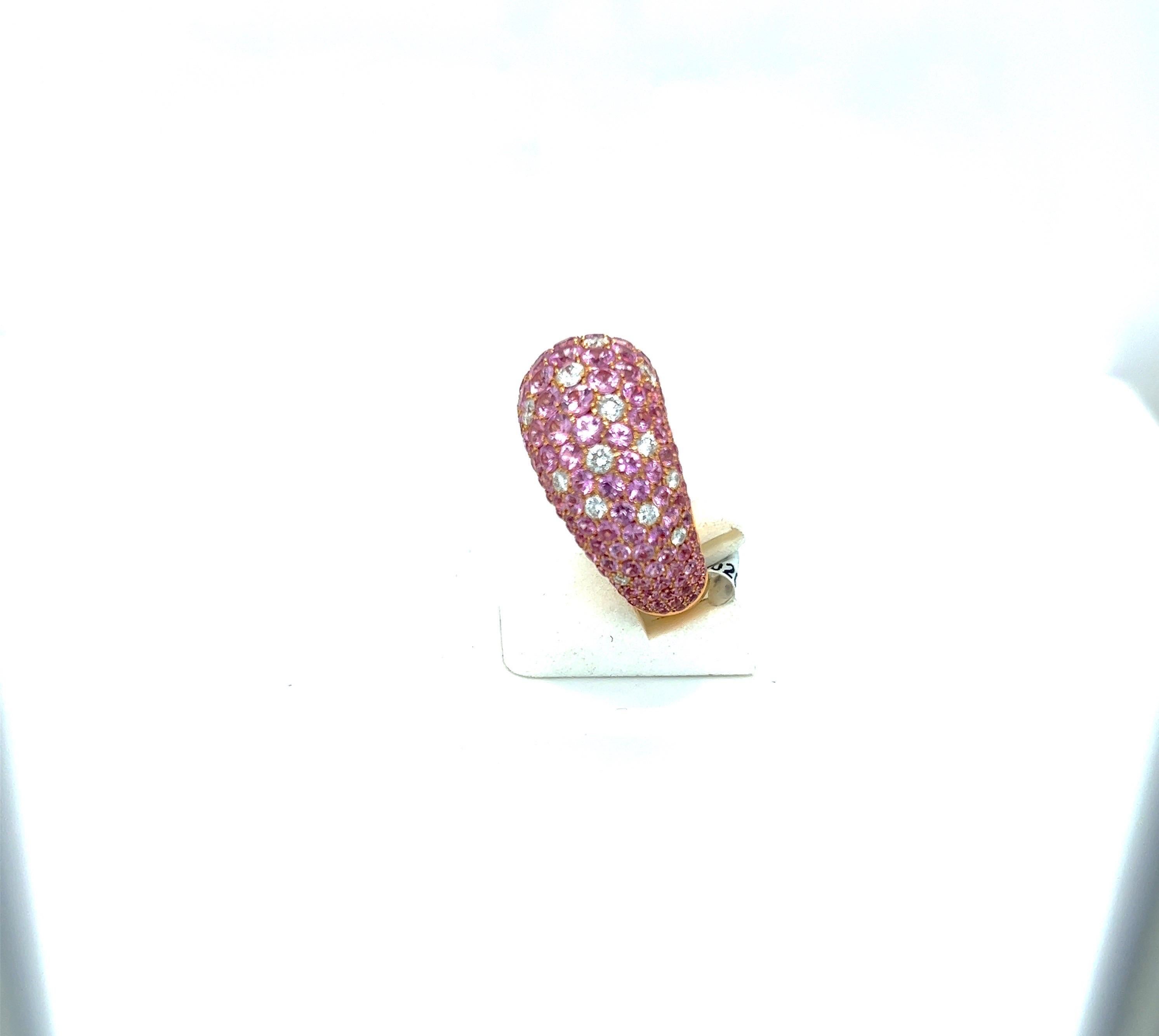 Lovely 18 karat rose gold dome shaped ring by Stenzorn. This ring is set with 8.20 carats of round pink sapphires. Sprinkled throughout is 0.90 carats of round brilliant diamonds.
Size 6.25