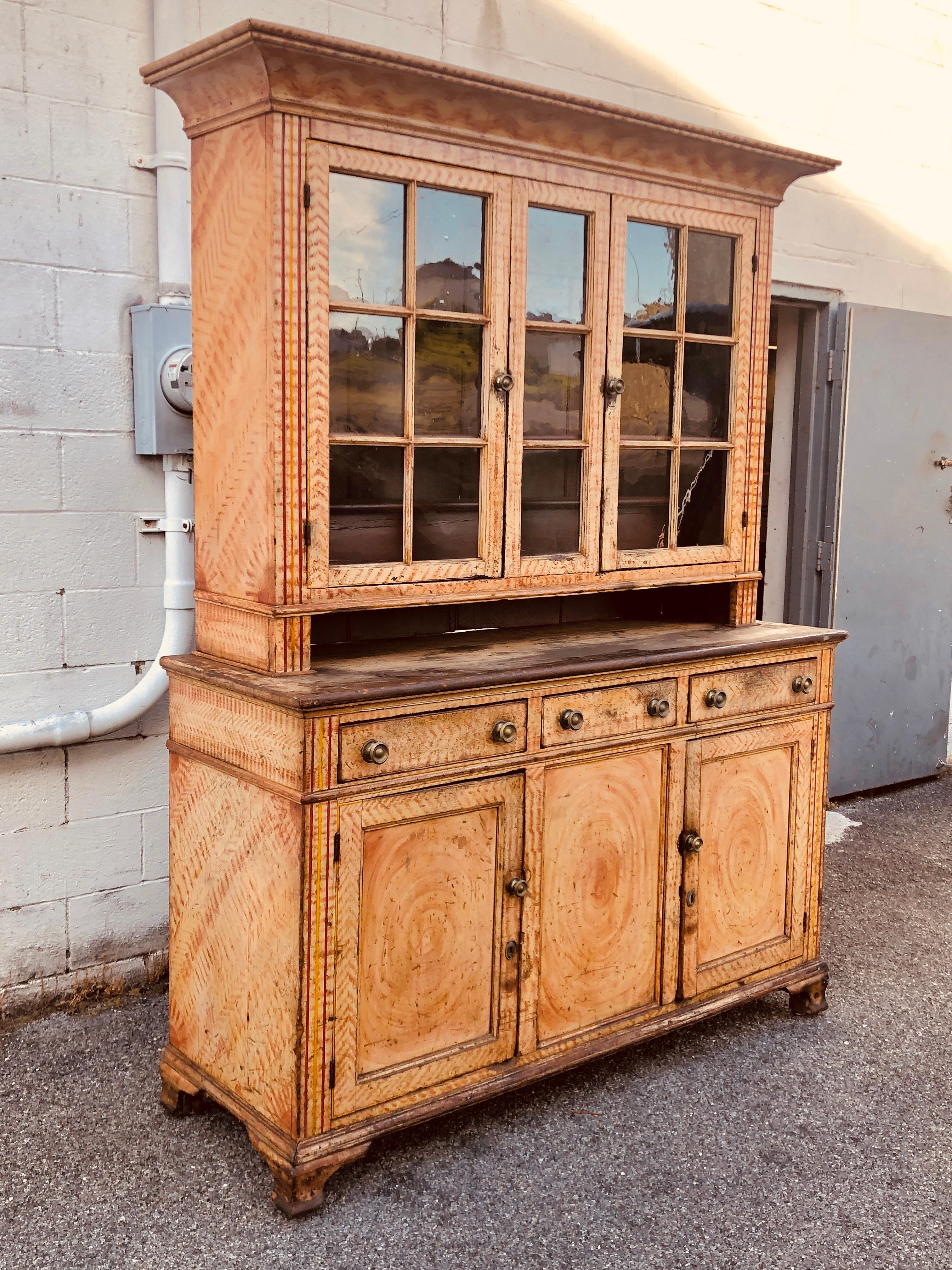 Step back flat wall cupboard original painted grained surface bucks County Pennsylvania, circa 1800 two-piece
12 pane two-door top
Original paint.