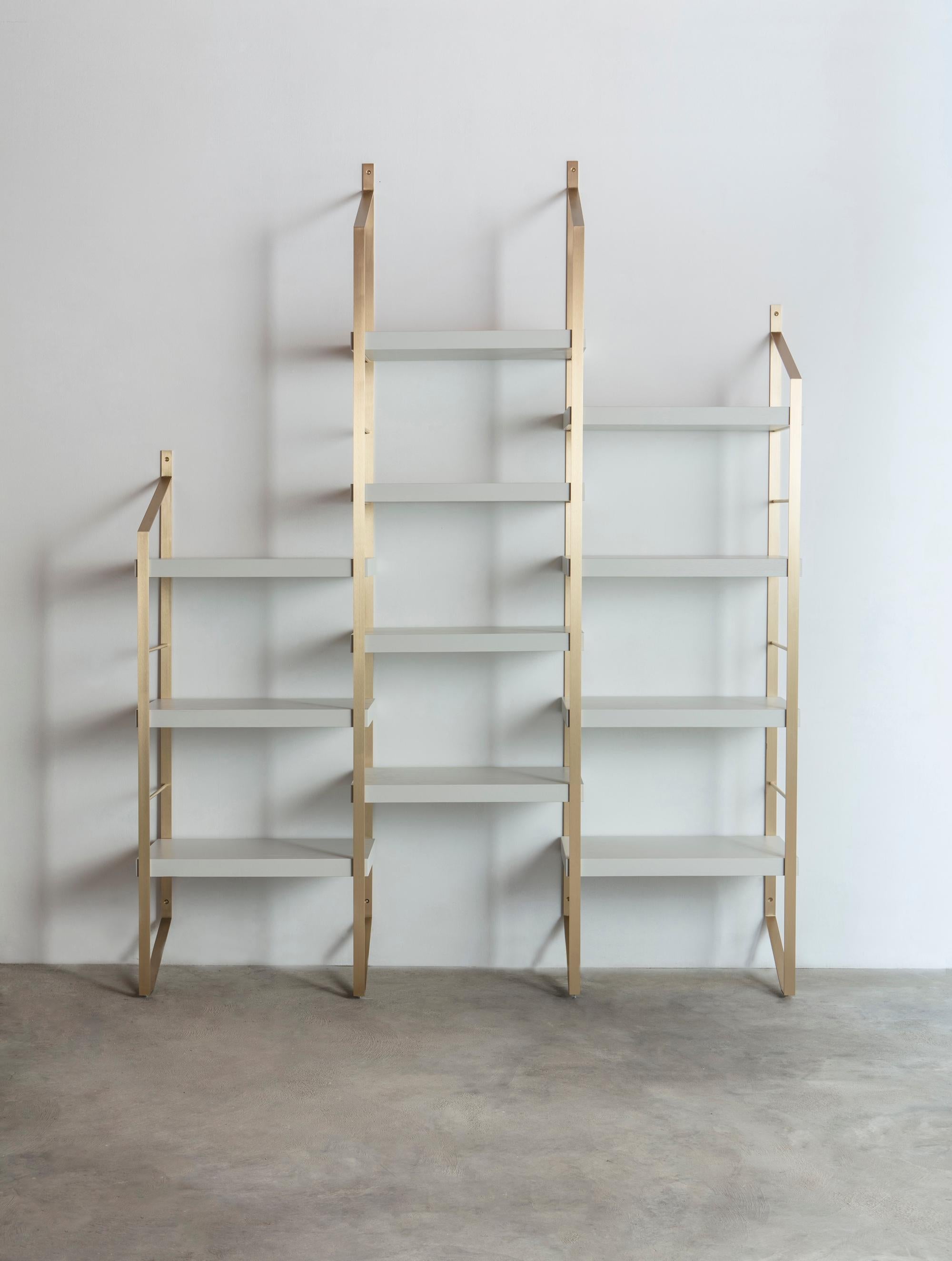 Step is a modular bookcase with brass structure, consisting of welded metal
plate and tubes. Three different heights of the columns allow to create a variety
of compositions. The shelves are assembled through simple joints. Brass uprights, like tape