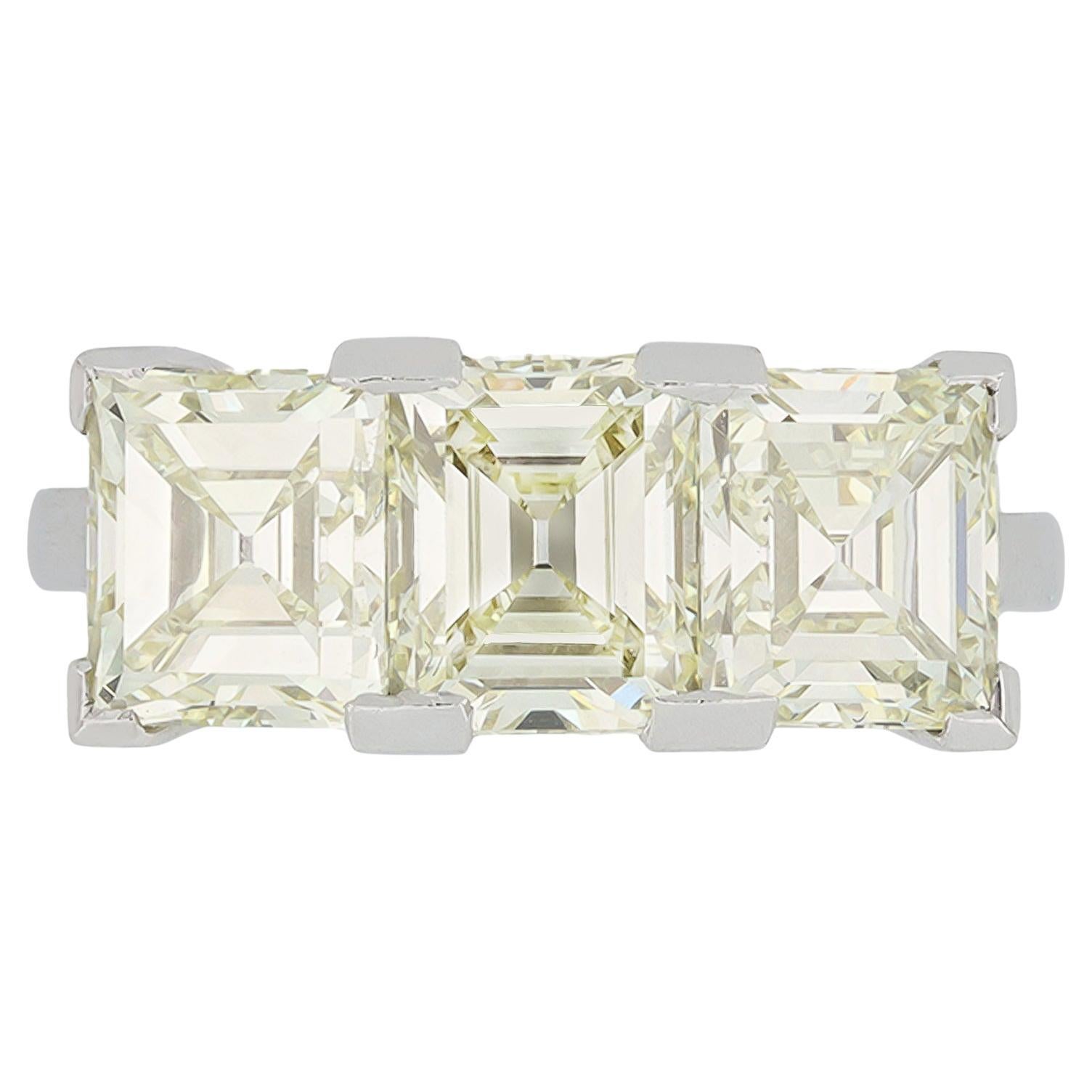 Step-cut diamond three stone ring, circa 1950. For Sale