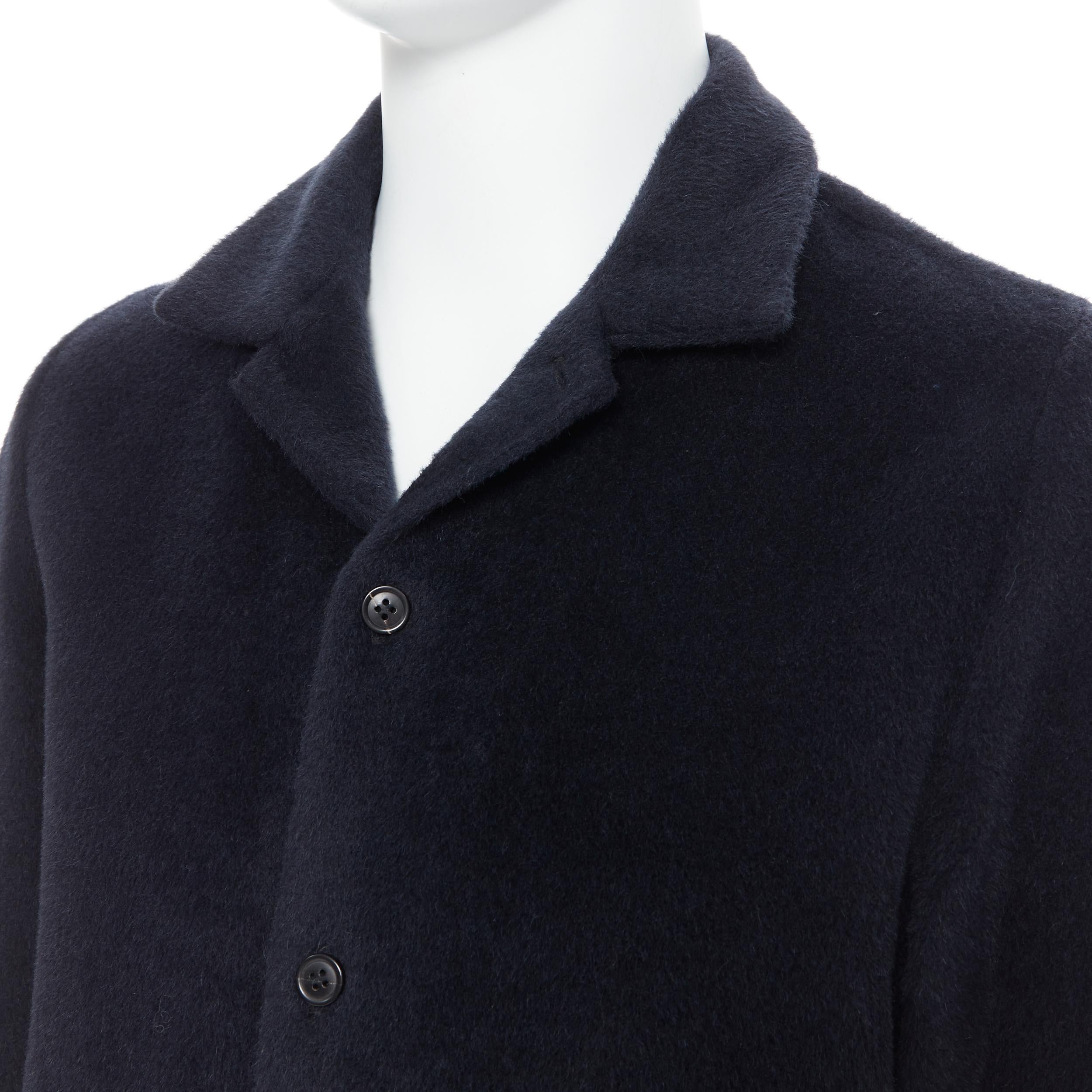 STEPHAN SCHNEIDER black alpaca wool notched collar overcoat shirt 3 M 
Reference: PRCN/A00062 
Brand: Stephen Schneider 
Designer: Stephen Schneider 
Material: Alpaca 
Color: Black 
Pattern: Solid 
Closure: Button 
Extra Detail: Spread notched