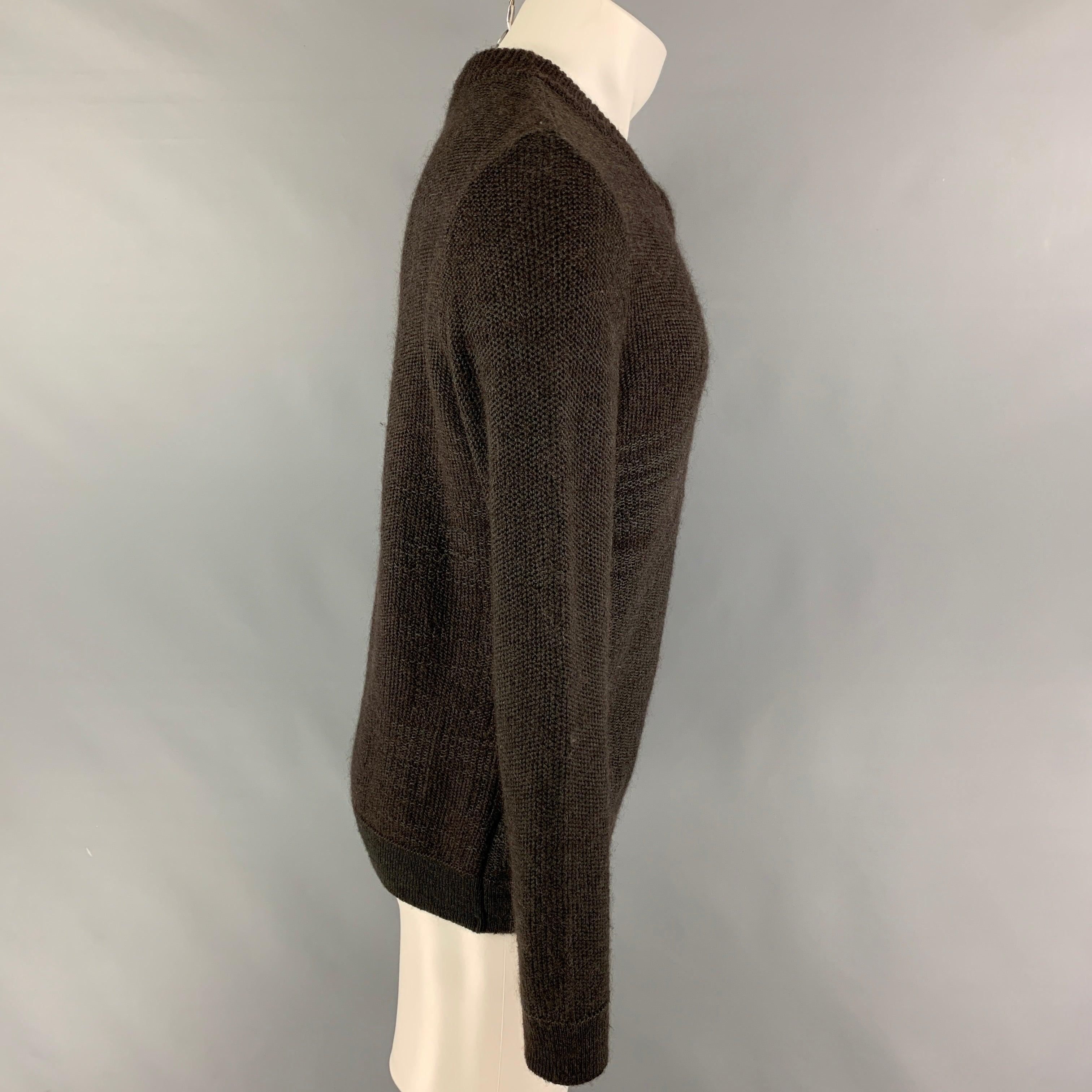 STEPHAN SCHNEIDER sweater comes in a brown & grey knitted wool blend featuring a v-neck. Made in Belgium.
Very Good
Pre-Owned Condition.  

Marked:   4 

Measurements: 
 
Shoulder:
17 inches  Chest: 42 inches  Sleeve: 28 inches  Length: 26.5 inches