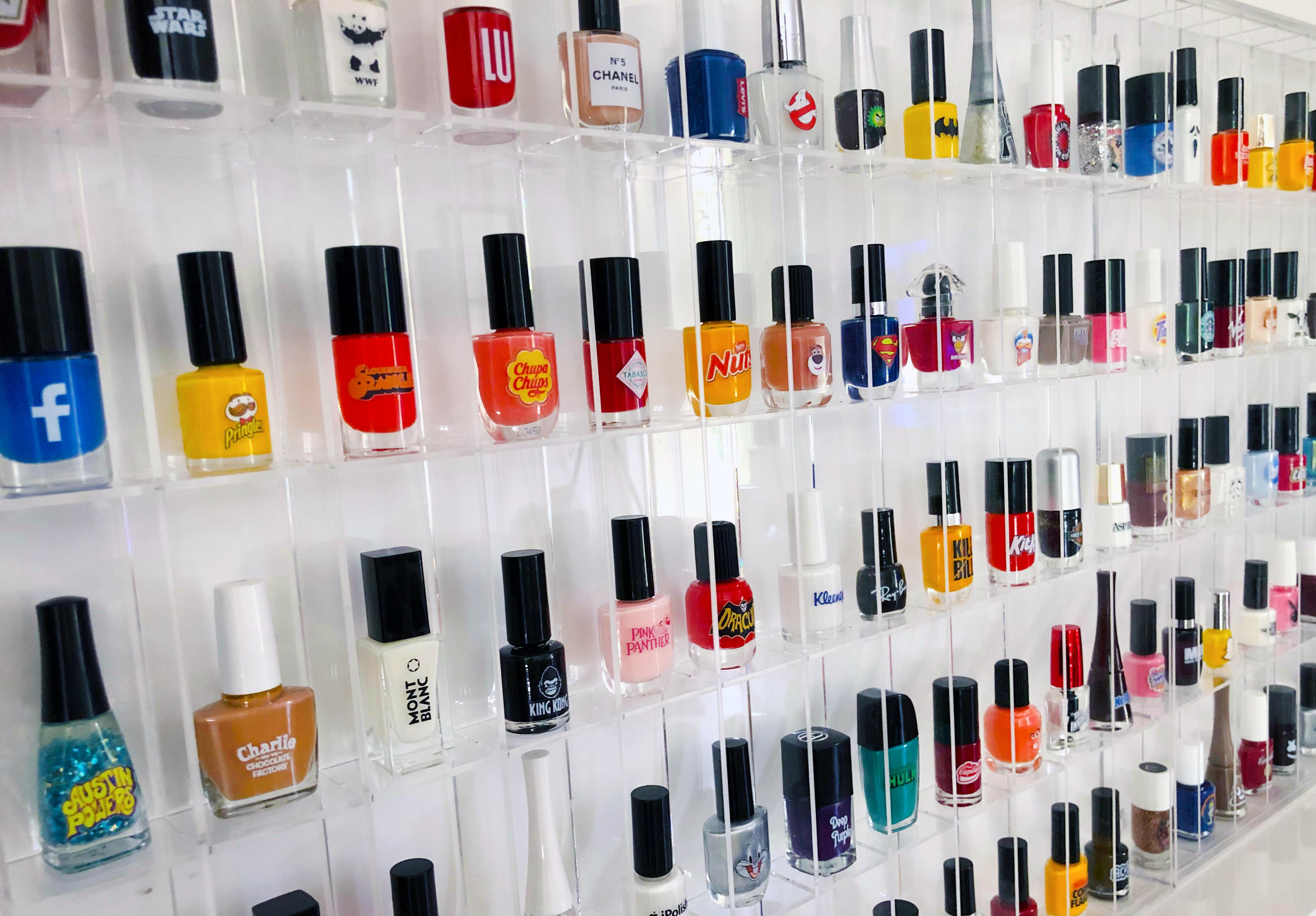 This seemingly simple arrangement of sculptural nail polish shaped bottles grows in detail the longer you look. Each bottle is branded with instantly recognizable images and logos, and carefully arranged as both an homage and criticism of nostalgic