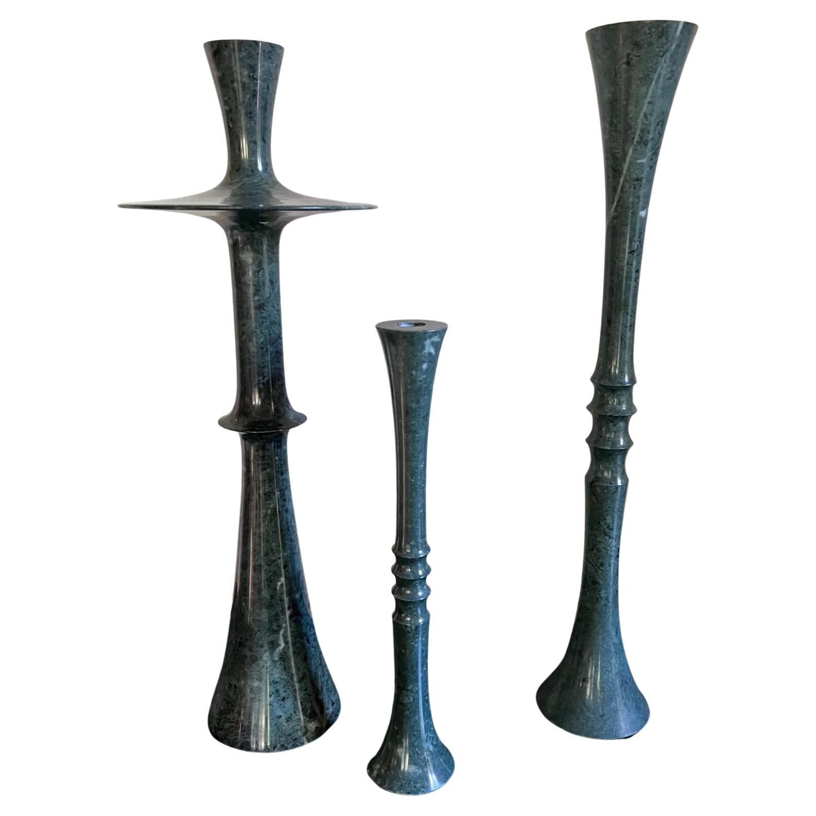 Solid marble candlestick set of three designed by French designer Paul Mathieu for Stephanie Odegard Co. Ltd. 

The marble candlesticks are hand turned, crafted in India and are symbolic of the hallmarks of Mathieu's work which includes graceful