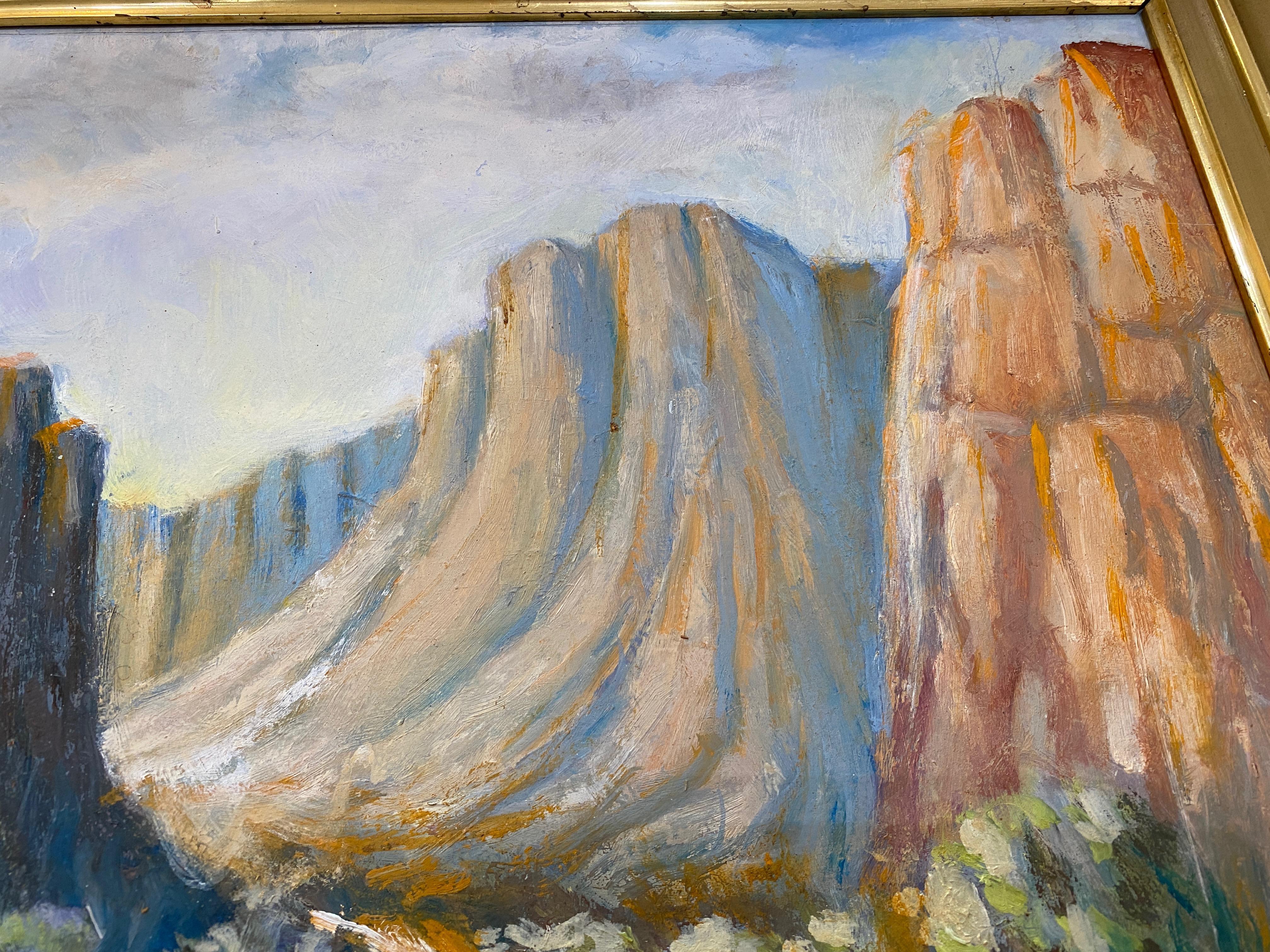 This picturesque landscape oil on board painting by Stephen A. Douglas depicts a scene of the Grand Canyon.  A dirt road entices the viewer to enter the canyon with Western flora at the base of the purple, orange and brown toned canyon walls.  A