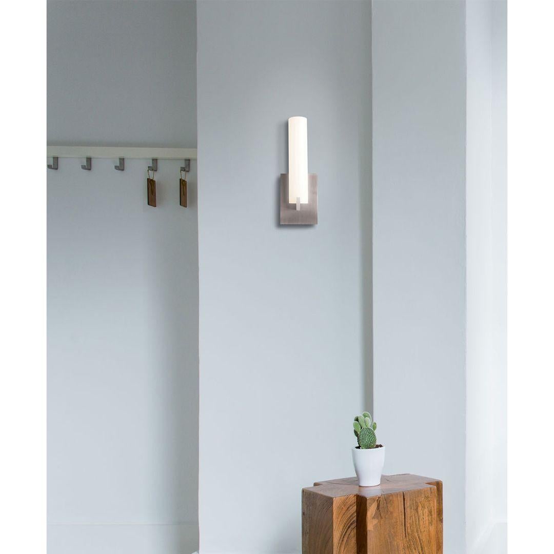 Stephen Blackman 'Elf 1' LED sconce lamp by Nemo.

Featuring luminous tubes of opal glass providing a diffused light and clean lines, the Elf 1 is brilliantly executed in brushed satin nickel and opal white glass. Designed to install directly to a