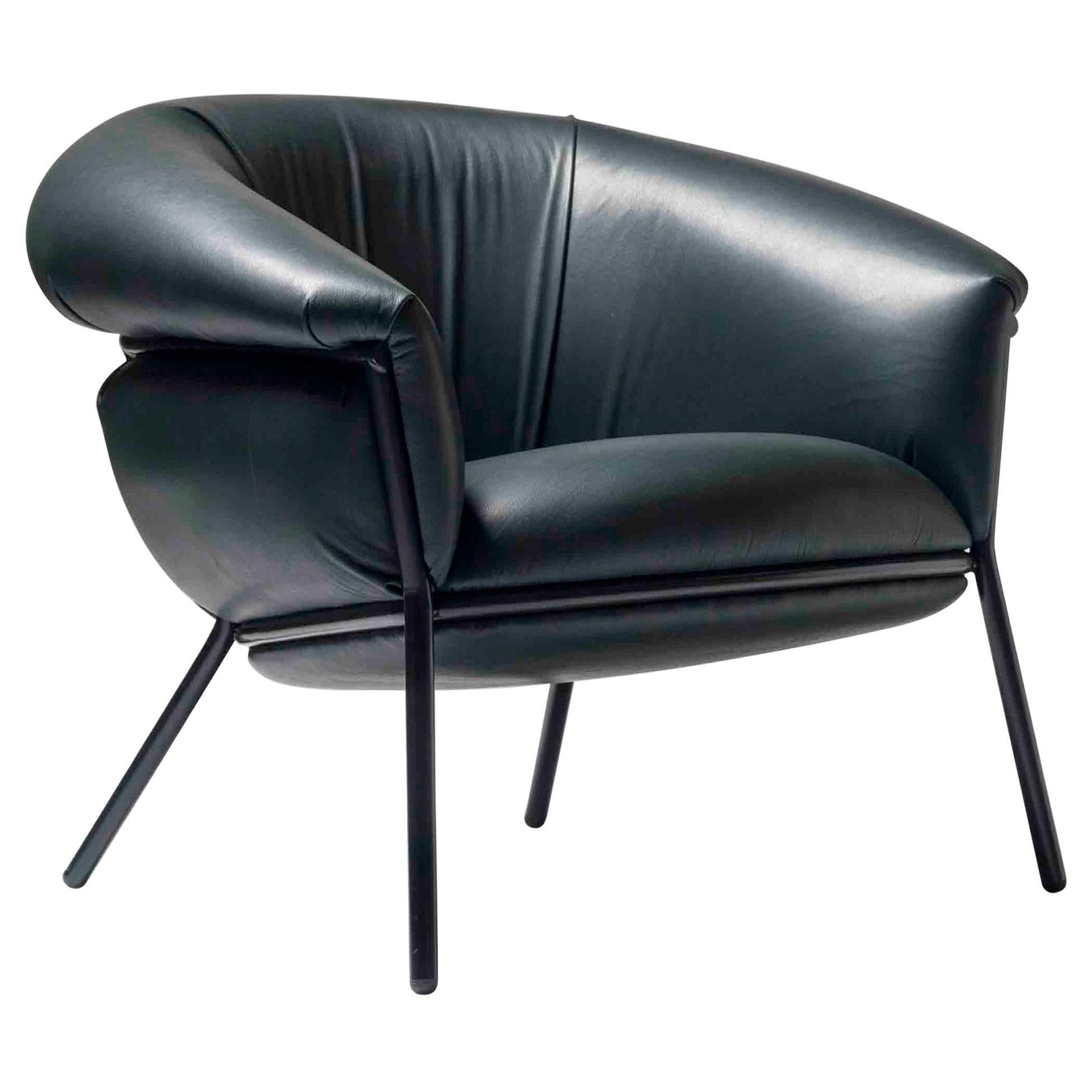 Armchair designed by Stephen Bruks manufactured by BD Barcelona.

An iron tubular (25mm) structured armchair. Seat and backrest upholstered in leather.

The leather upholstery oozes over the bare iron structure to contrast with the most