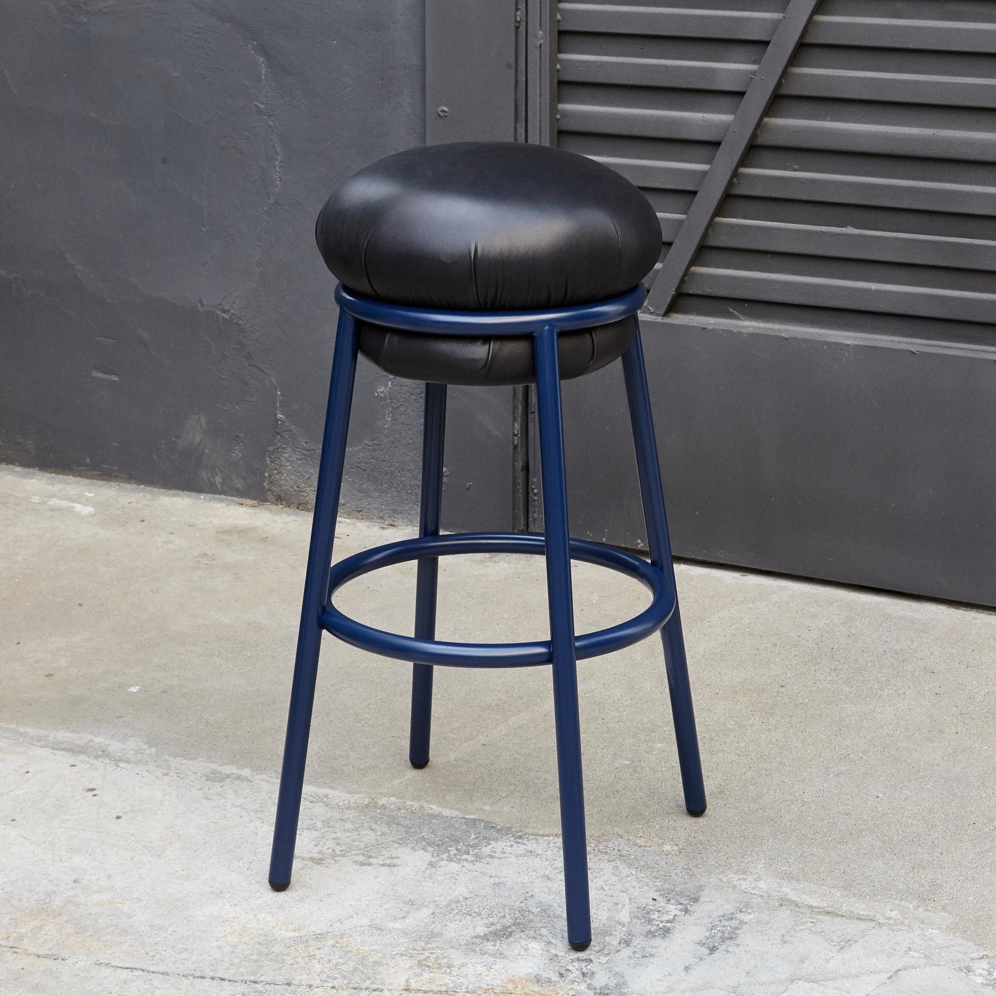 Stool designed by Stephen Burks.

Blue iron tubular (25mm) structured armchair. Seat upholstered in blue leather with blue structure.

The leather upholstery oozes over the bare iron structure. 

Measure: Ø 36 x H 80 cm

Year: 2018.

In good