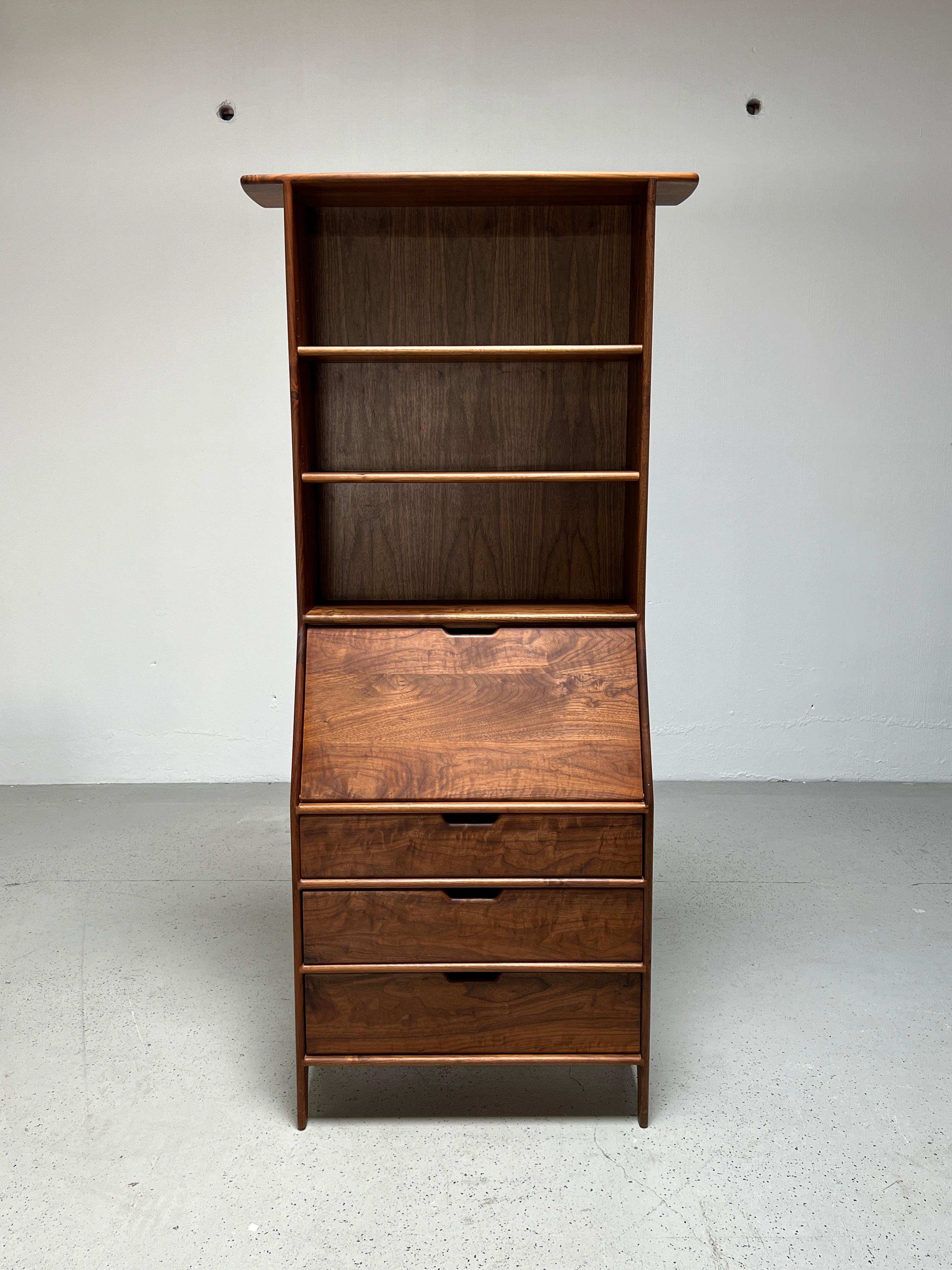 A beautifully crafted walnut secretary with drop down desk inscribed 