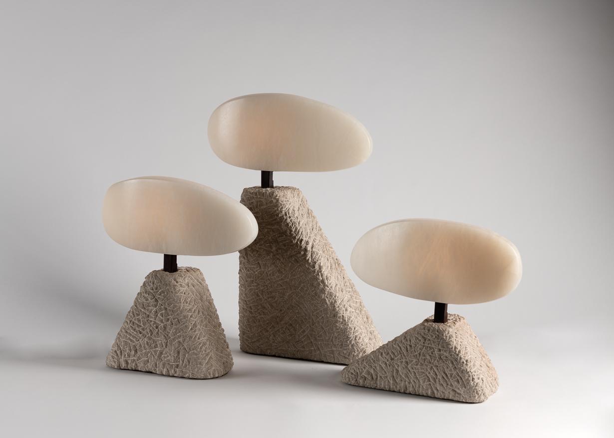 This set of table lamps by Stephen Downes, alabaster expert and student of Master Stone Carver René Lavaggi, are made of polished alabaster, patinated steel, and textured limestone and emit a soft light through their thick alabaster shades.

Small