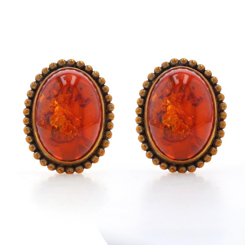 Retail Price: $1595

Brand: Stephen Dweck

Metal Content: Brass (necklace & earrings) with Sterling Silver (earring backs)

Stone Information
Natural Amber
Cut: Oval Cabochon
Color: Orange
Approximate Sizes: 24.5mm x 17.5mm (earrings) & 50.5mm x