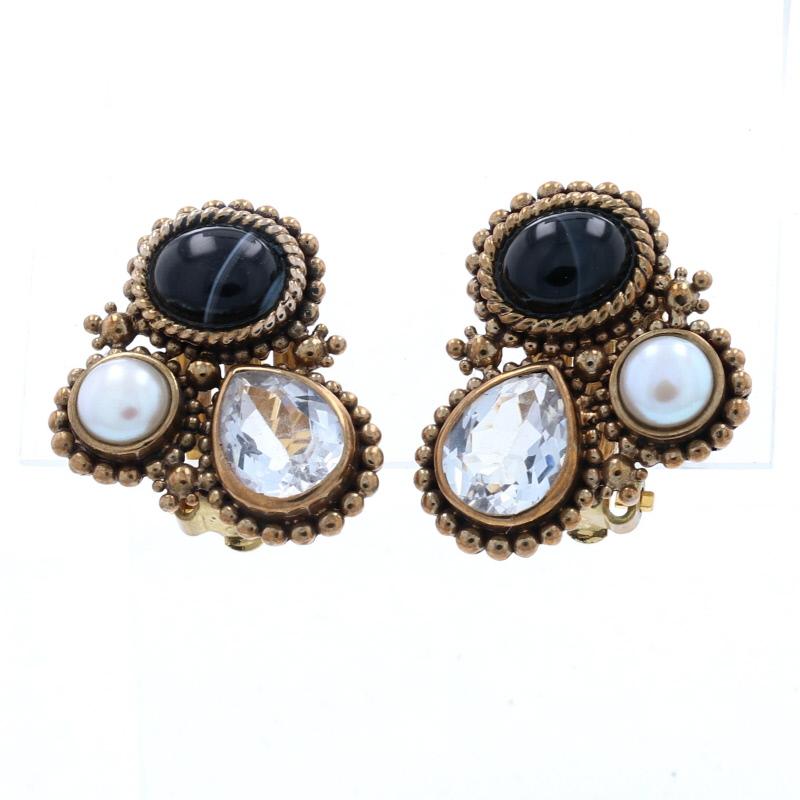 Brand: Stephen Dweck

Metal Content: Brass

Stone Information: 
Genuine Banded Agate
Cut: Oval Cabochon
Colors: Black & White

Genuine Cultured Pearls

Genuine Quartz
Cut: Pear

Style: Large Stud
Fastening Type: Clip-On Closures
Theme: