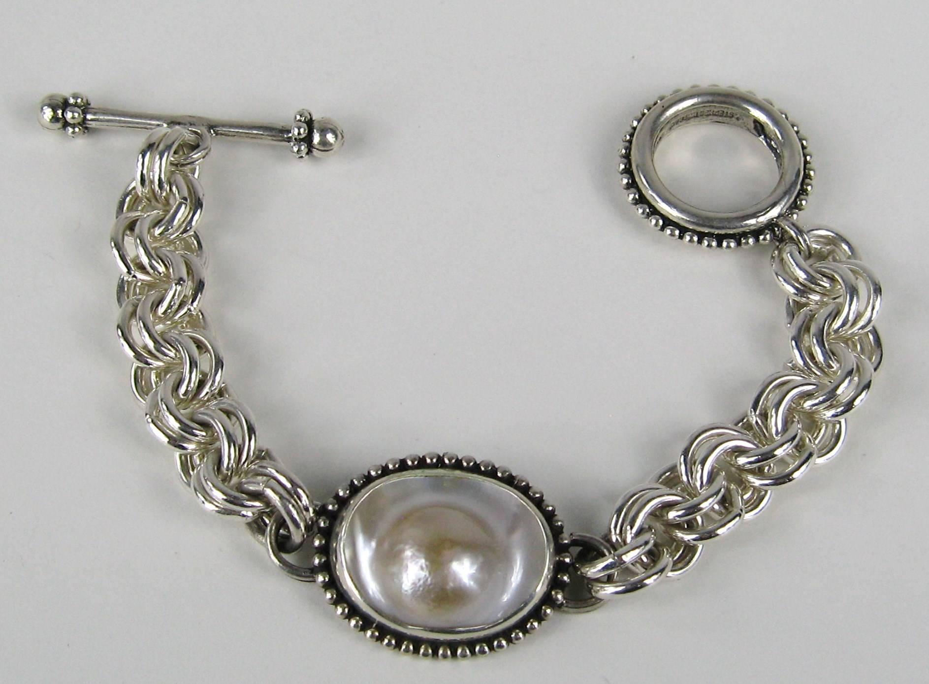 Stephen Dweck Sterling Silver New old stock, tags still attached. Purchased from his collections from the 1990s. Rose Blister Mabe Pearl Bracelet measures 7.5' end to end. This is a small bracelet will fit a 5-6
