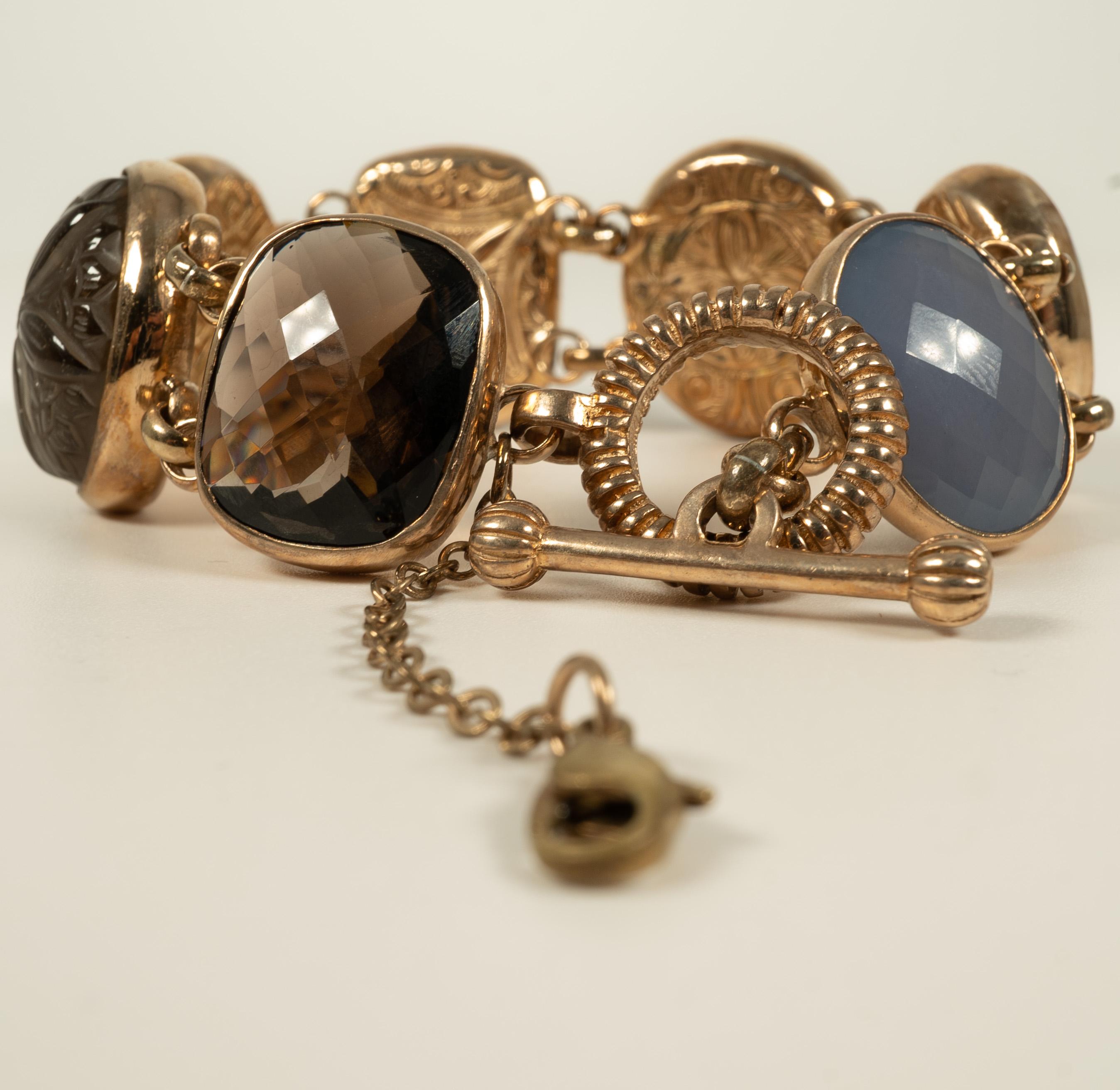 By jewelry designer Stephen Dweck, this brass, quartz and cameo bracelet is secured with a toggle clasp and safety chain.