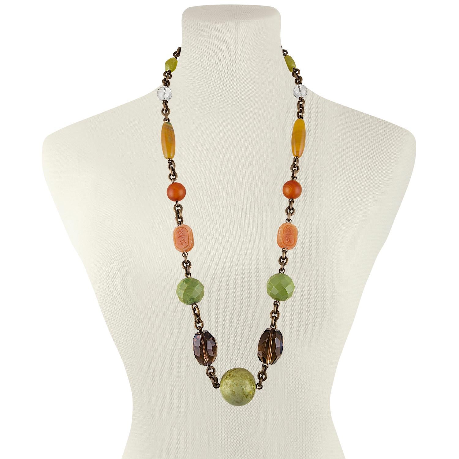 Stephen Dweck Long Necklace
The necklace is brass 
There is Smokey Topaz, Agate, Crystal, etc.
The necklace is 33