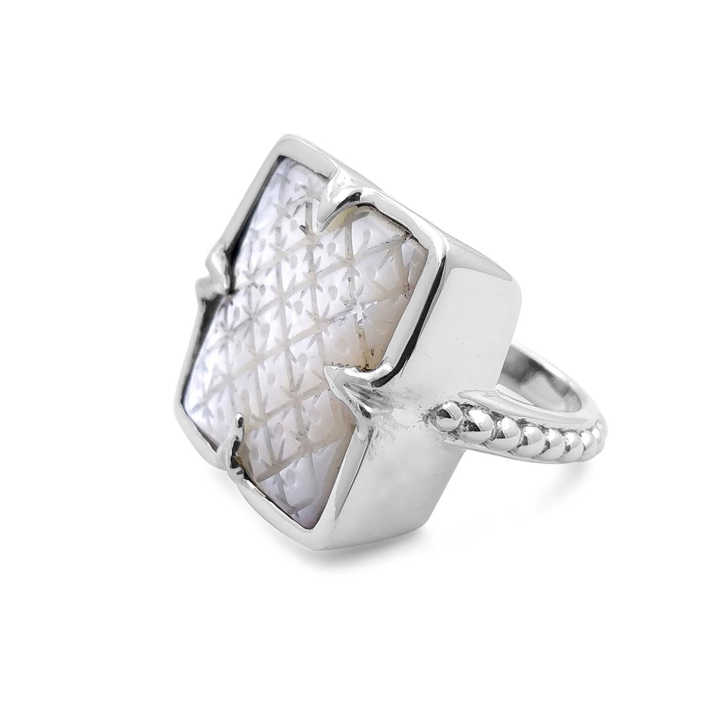 Indulge in the timeless elegance of Steven's jewelry with the Shimmering Sterling Silver Stephen Dweck Mother of Pearl Clover Ring. Crafted with meticulous attention to detail, this exquisite piece showcases the natural beauty of mother of pearl in