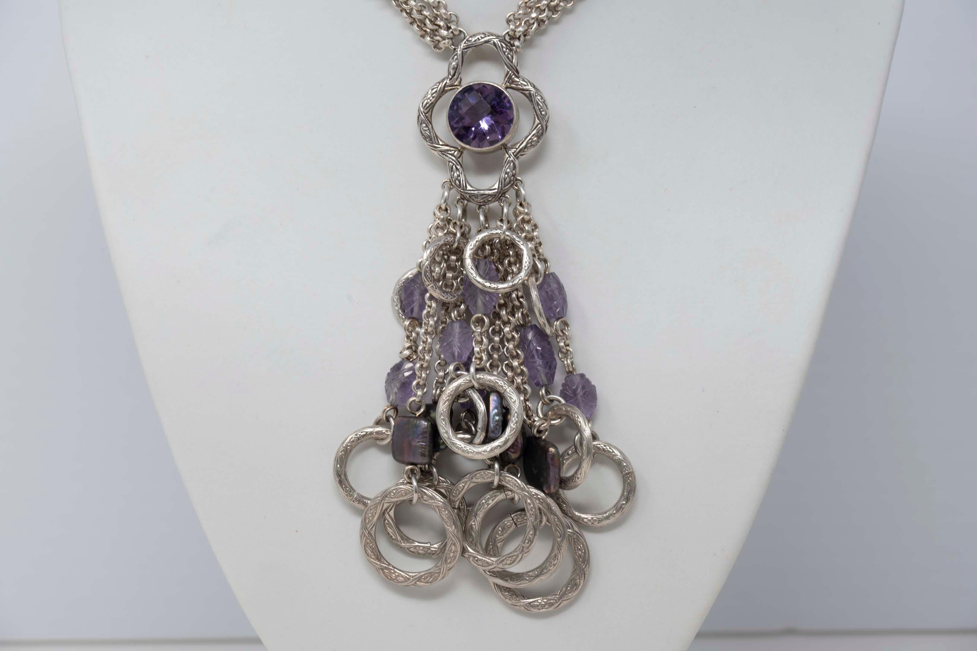 Vintage 925 silver necklace with 9 amethyst and 4 square flat black pearls by Stephen Dweck. It is signed on the inside of the necklace clasp. It is in excellent condition, the chain measures 15 inches long and the pendant in the center measures 5