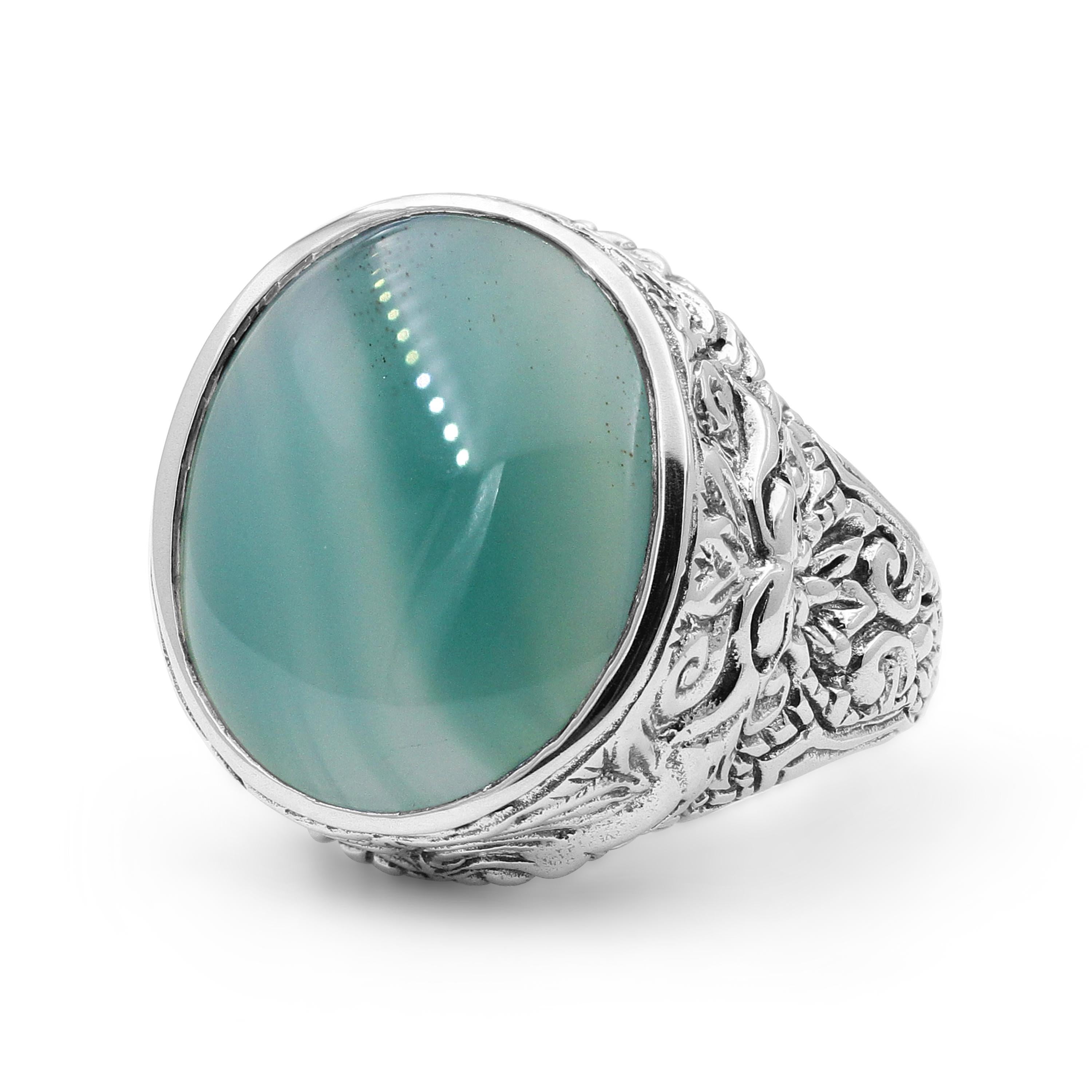 This beautiful Stephen Dweck Sterling Silver Signet Ring features a smooth Agate gemstone (16mm x 20mm) flattered with luscious carvings of sterling silver. Drawing inspiration from a love of nature and passion for art, each Stephen Dweck creation