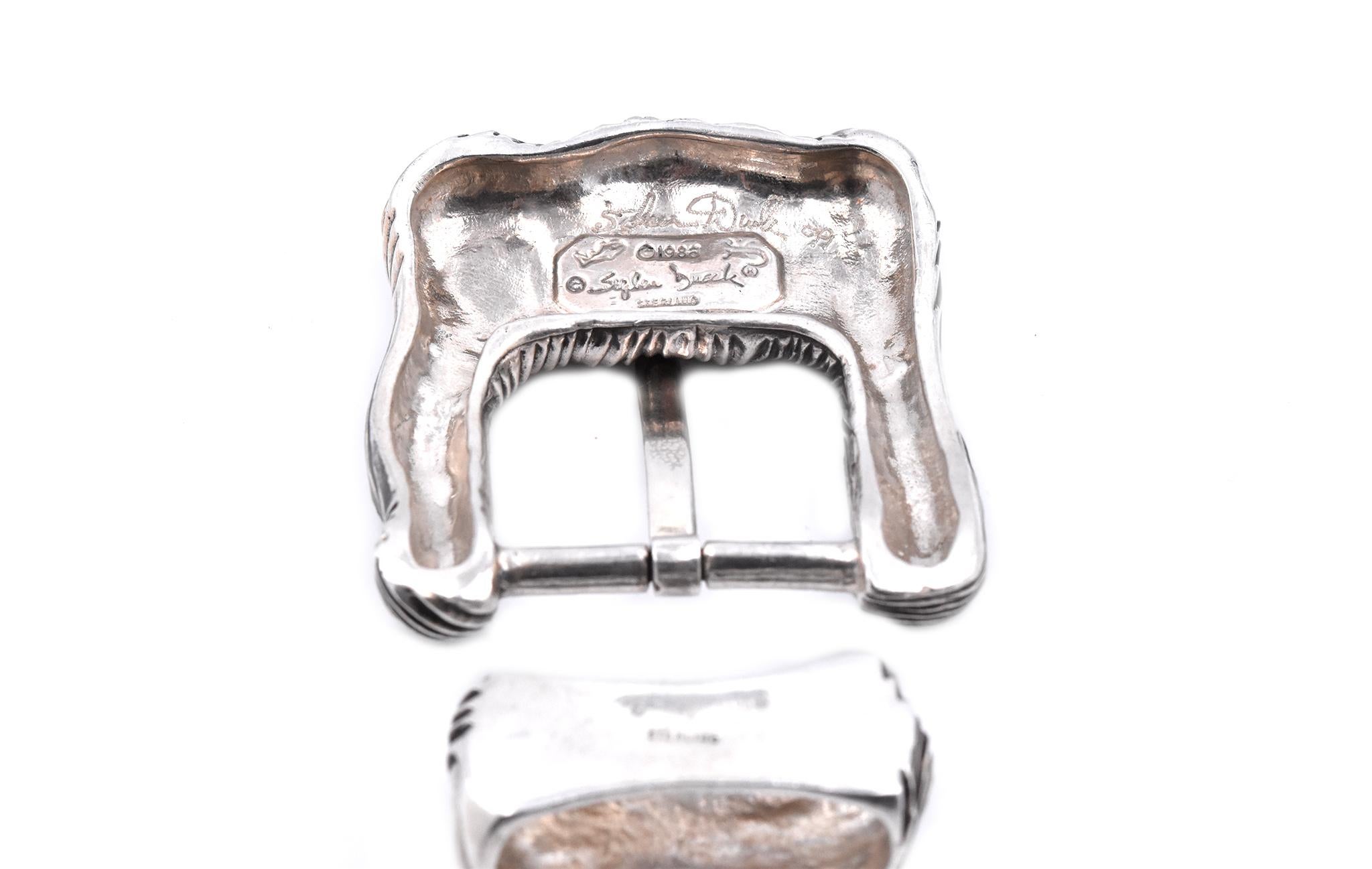 Designer: Stephen Dweck
Material: sterling silver
Dimensions: buckle measures 60mm x 54mm
Weight: 102.2 grams
