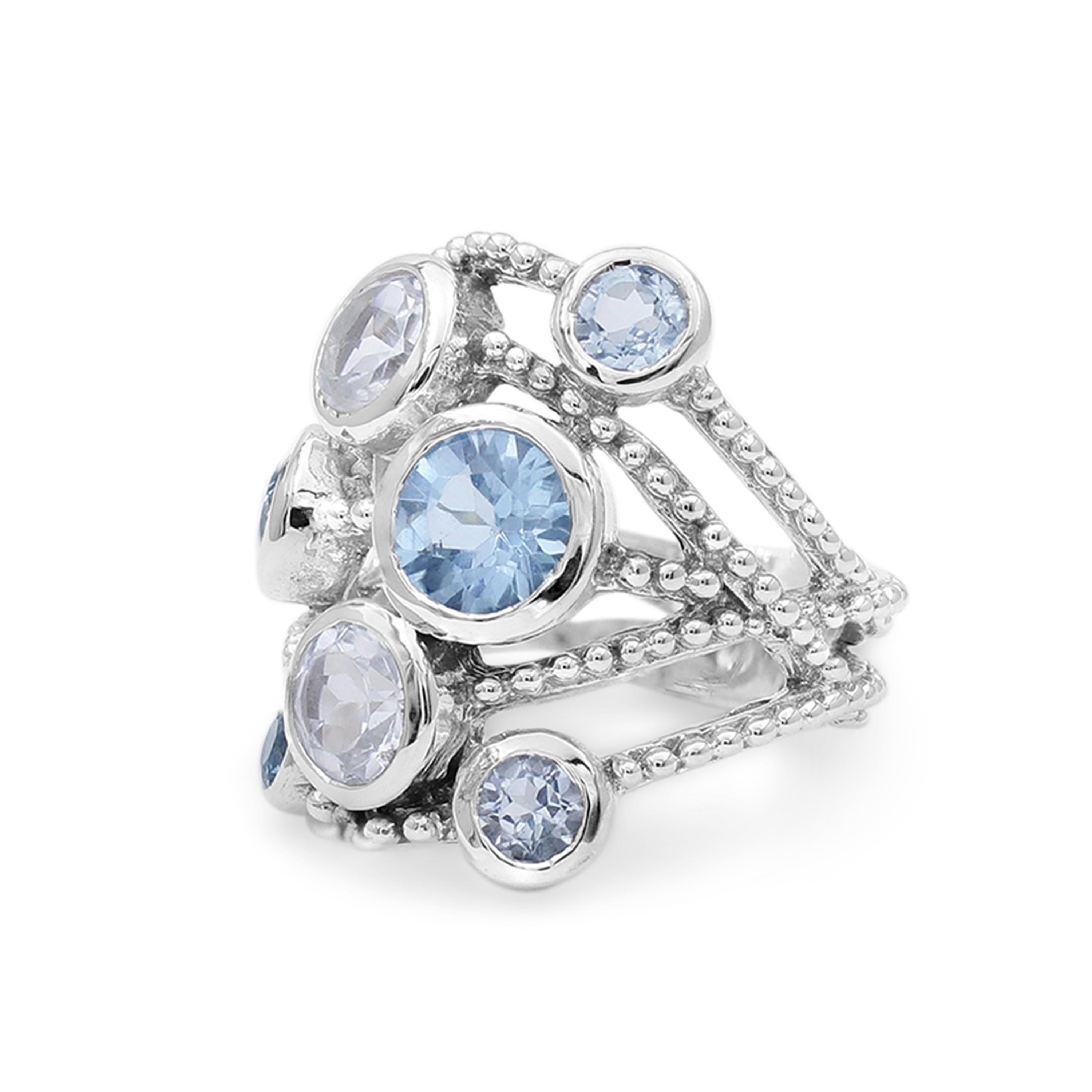 This spectacular Stephen Dweck Sterling Silver Statement Ring features layers of beaded sterling silver with a sparkle of dreamy hues cast from bezel set London Blue Topaz & White Topaz (3mm-6mm). Drawing inspiration from a love of nature and