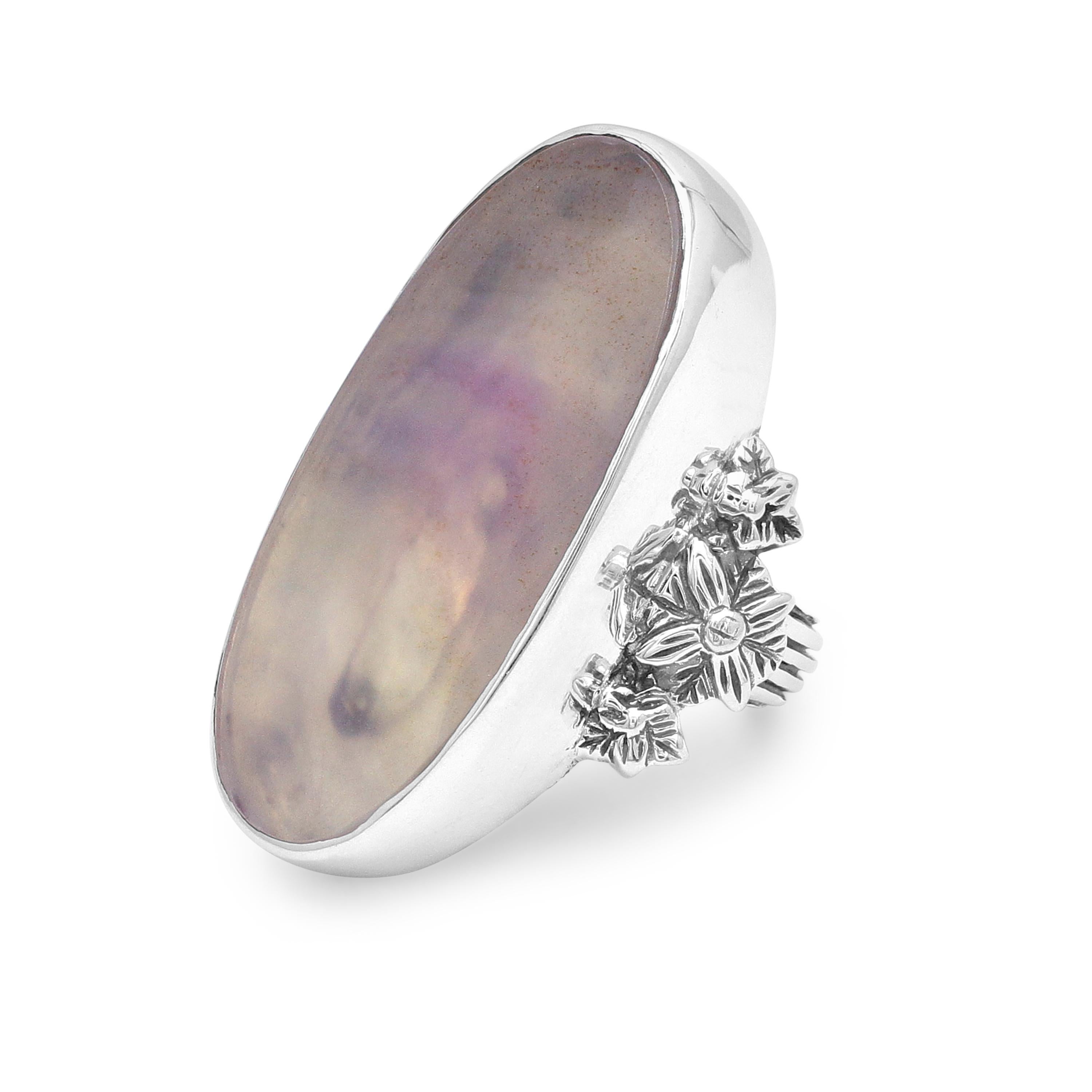 This show-stopping Stephen Dweck Sterling Silver Statement Ring features a dreamy Natural Quartz and Agate doublet 19mm x 38mm flattered with floral shanks of sterling silver. Drawing inspiration from a love of nature and passion for art, each