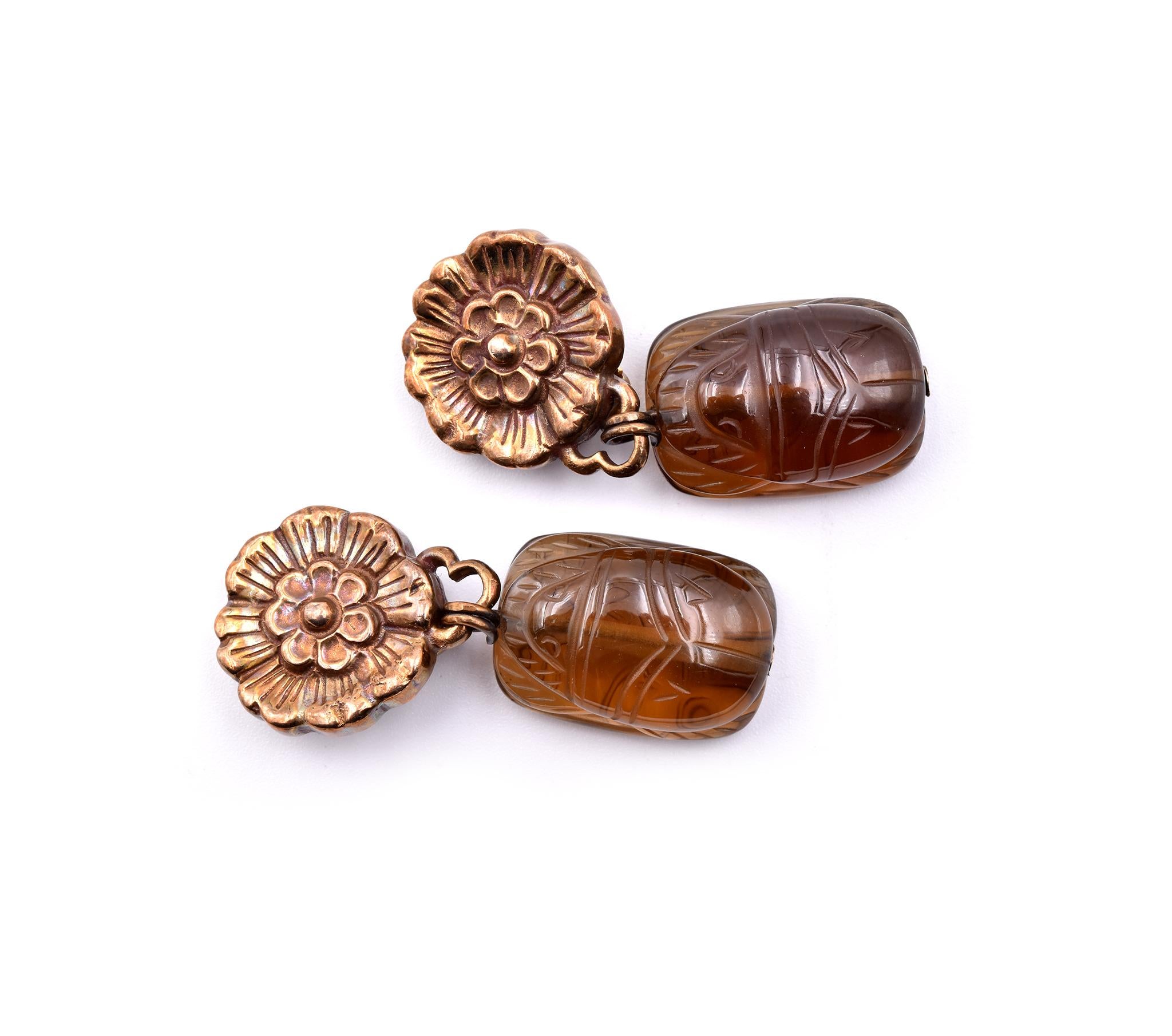 Designer: Stephen Dweck
Material: sterling silver
Gemstone: 2 carved smoky topaz
Dimensions: earrings measure 45mm x 16.95mm
Fastening: clip on
Weight: 15.50 grams	
