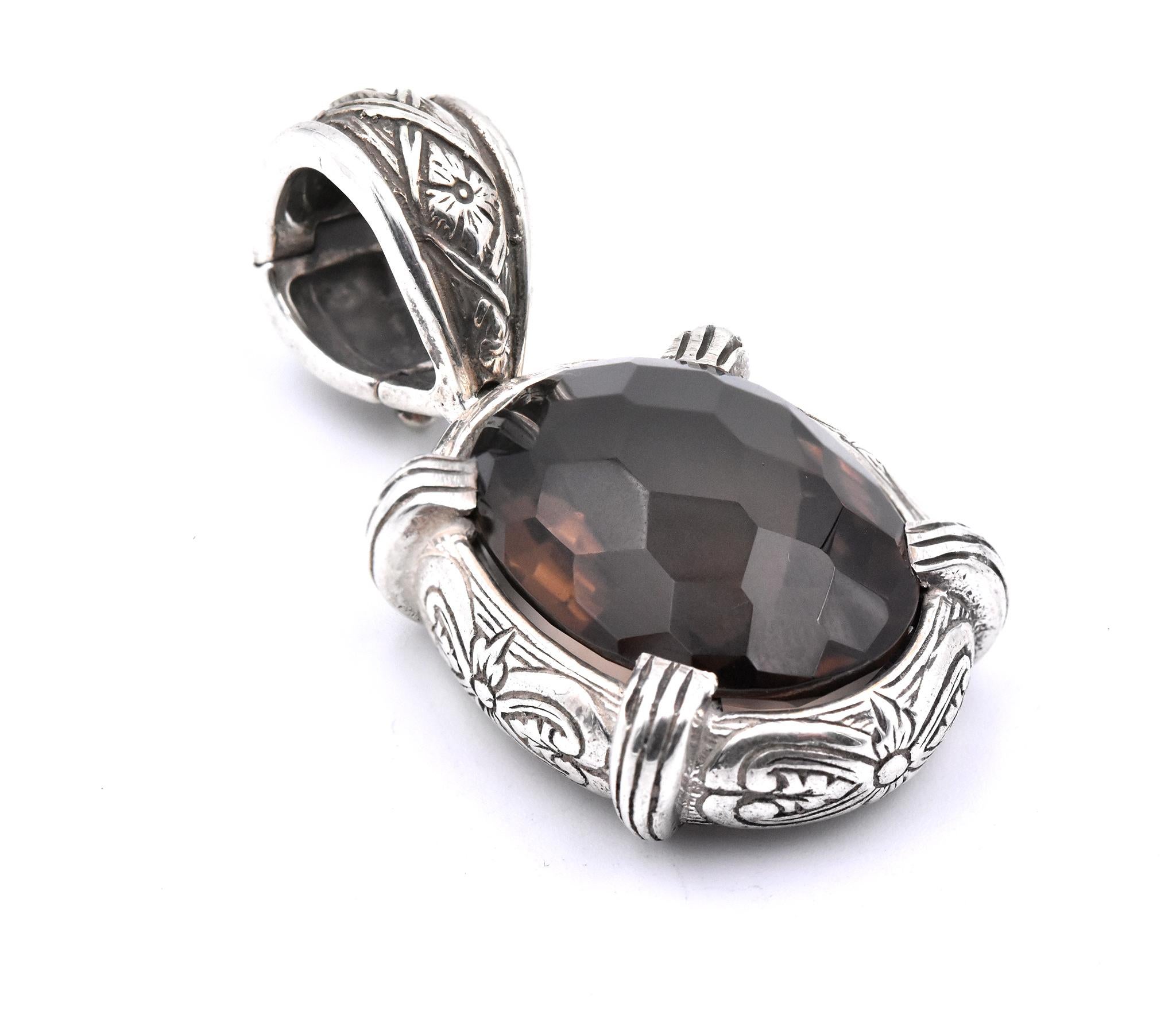Designer: Stephen Dweck
Material: sterling silver
Gemstone: 1 oval faceted smoky topaz
Dimensions: pendant measures 48.80mm x 23.80mm
Weight: 24.82 grams	
