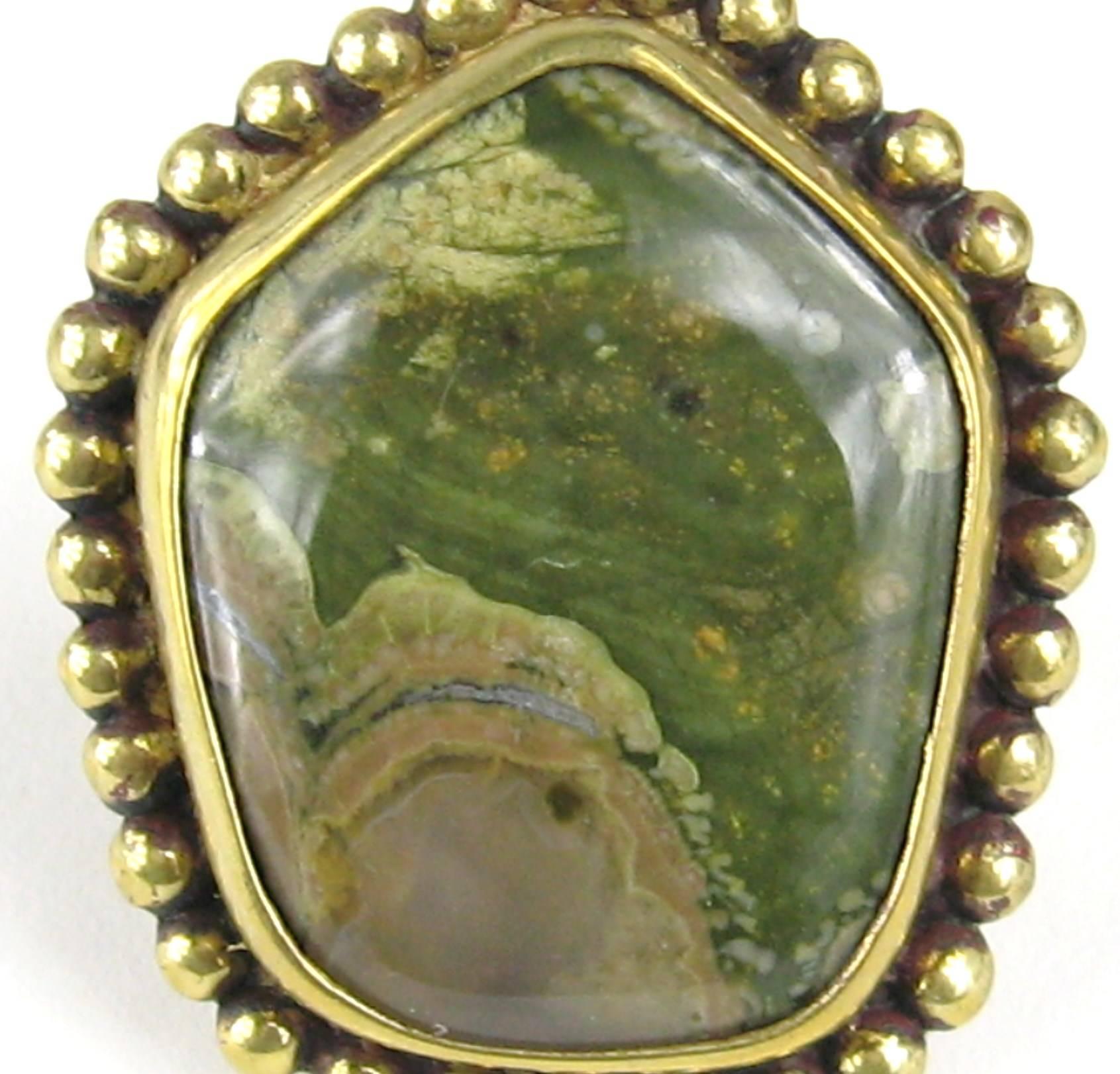 This is vintage Dweck, dated 92 inside shank of the Ring Bronze wash over the sterling. This is a Massive Vintage Stephen Dweck Sterling Silver Ring. The stone looks like Jasper. We have many more pieces of Dweck listed on our storefront. This is