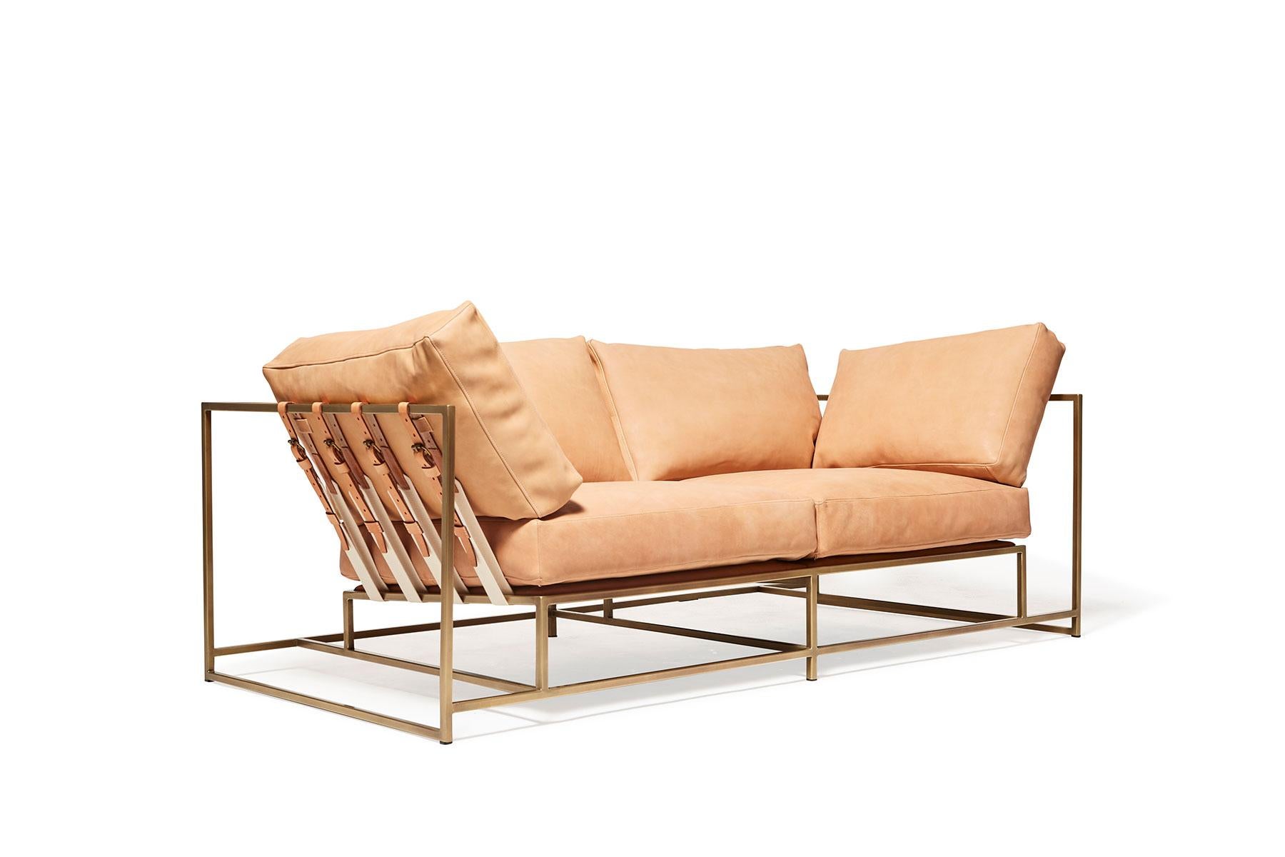 The Inheritance Two Seat Sofa by Stephen Kenn is as comfortable as it is unique. The design features an exposed construction composed of three elements - a steel frame, plush upholstery, and supportive belts. The deep seating area is perfect for a