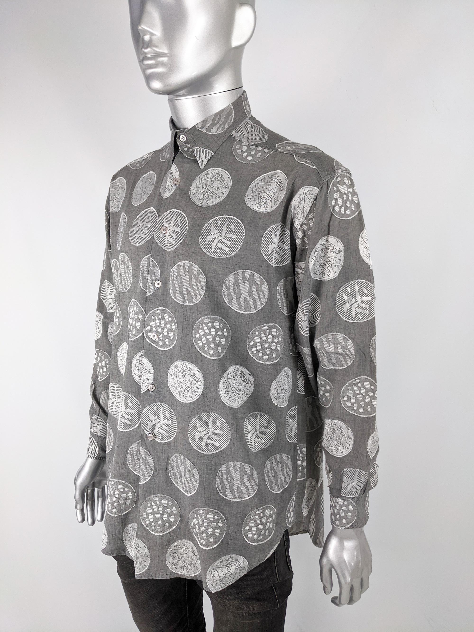 An amazing vintage mens long sleeve shirt from the 80s by cult Irish fashion designer, Stephen King, known for his incredible shirts. In a grey jacquard fabric with abstract patterns throughout. Perfect for a party or a bold look in the day. 

Size: