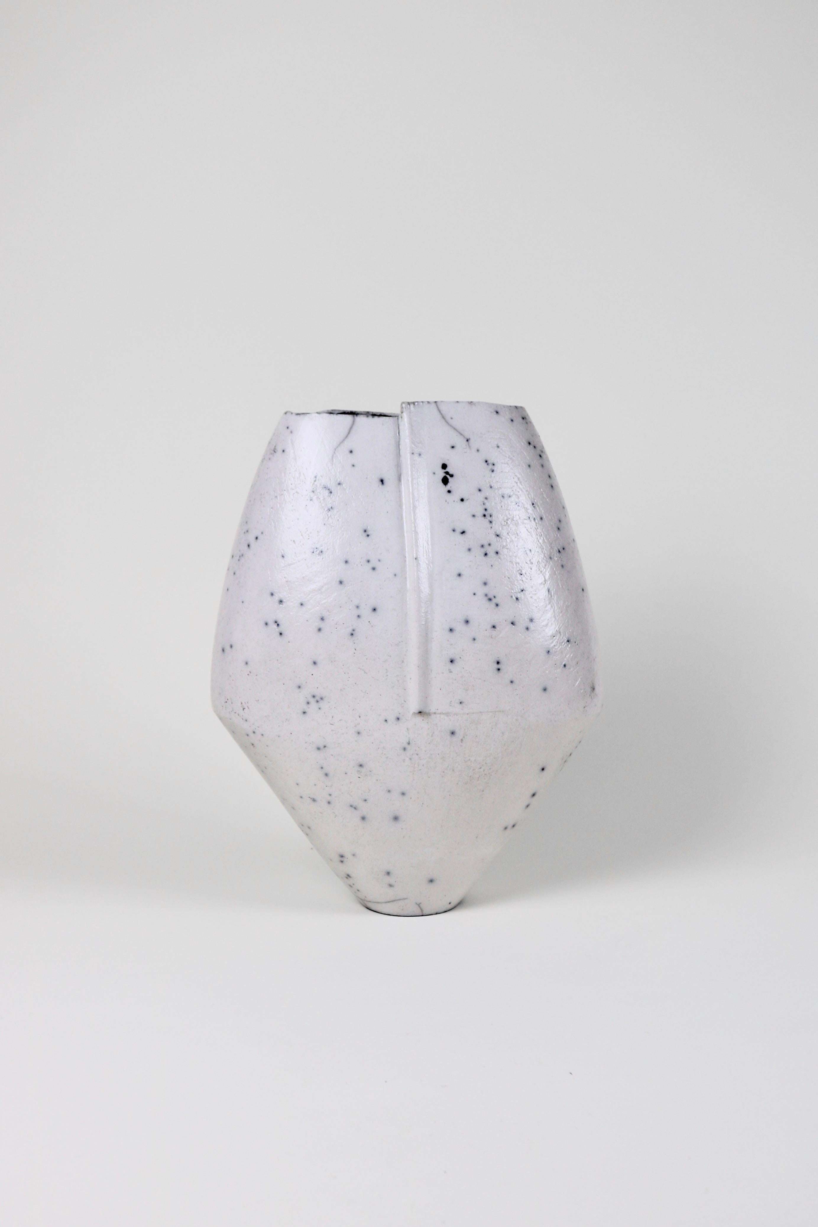 An impressive large-scale vase from Stephen Murfitt. The vase is handbuilt and raku-fired leaving delicate black markings throughout.

Measures: H 36cm
W 28cm
D 11cm.
