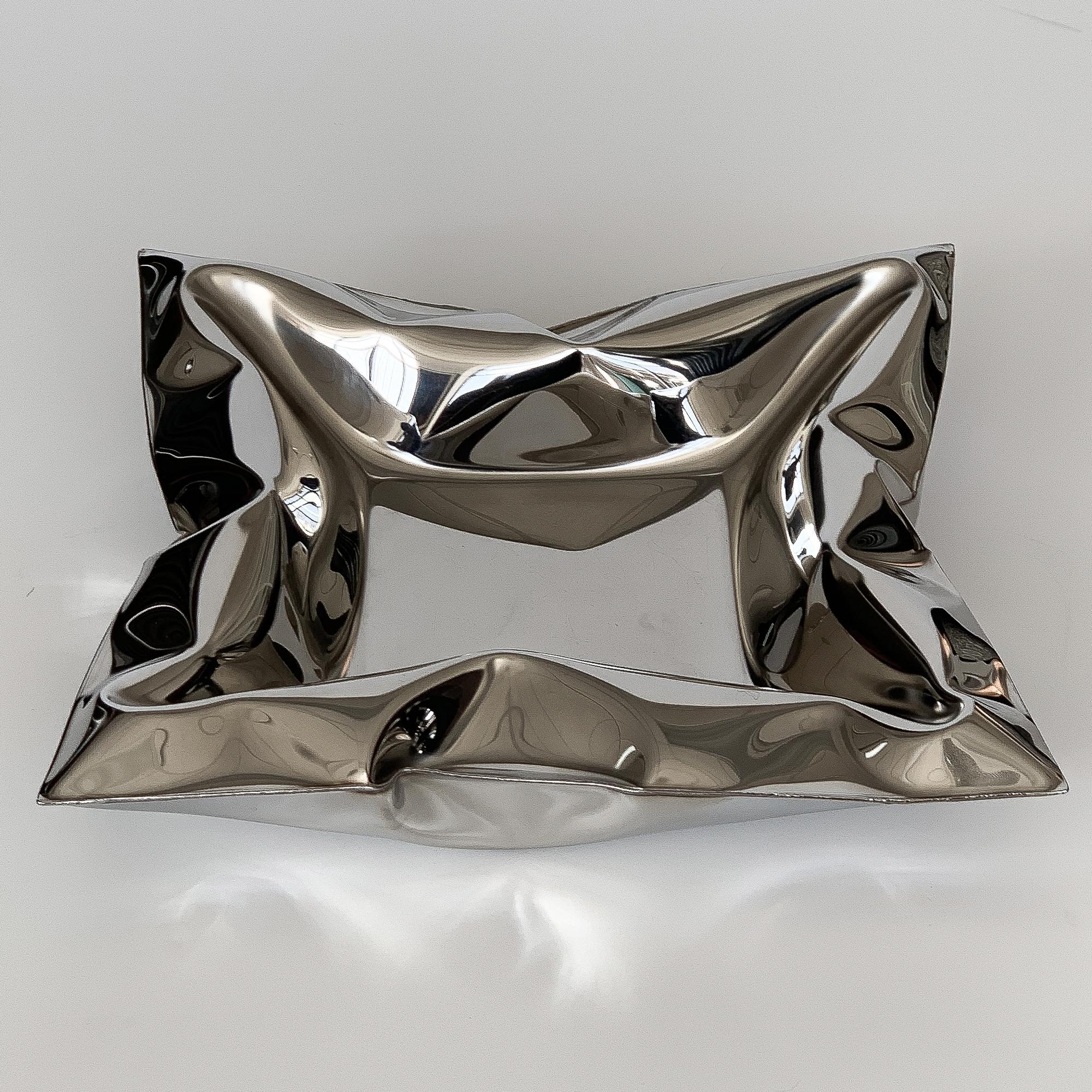 Stephen Newby inflated mirror polished stainless steel bowl from the early Full Blown series, circa 1990s. Unsigned. Minor surface scratches to the interior of the bowl. 

Sculptor and artist Stephen Newby began working with inflating stainless