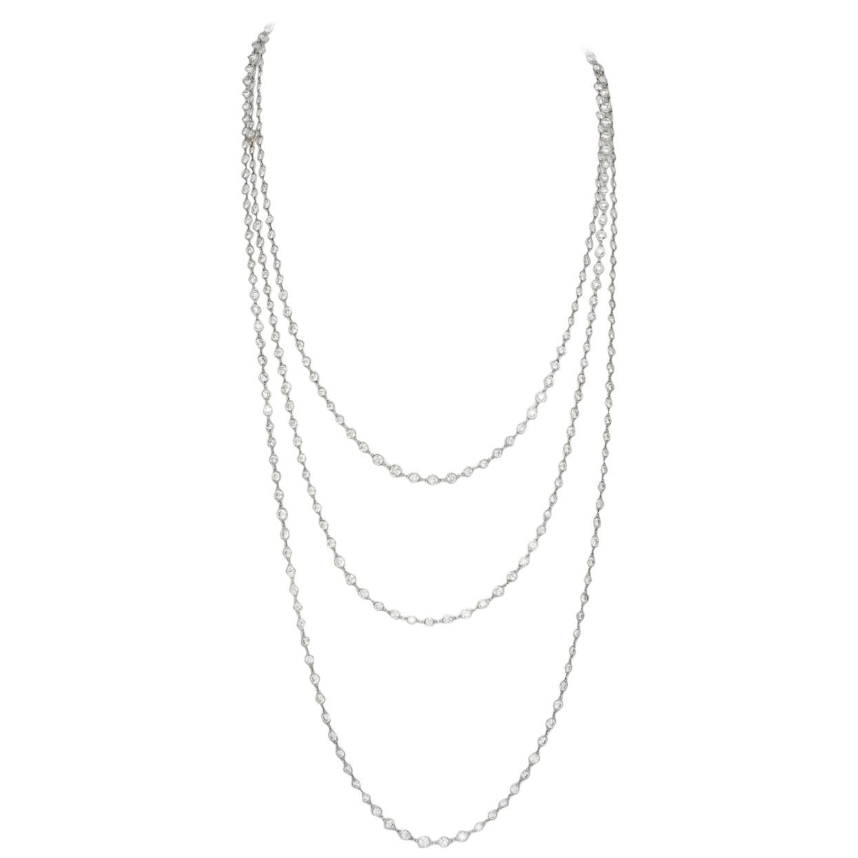 This Stephen Russell Diamond and Platinum Chain is set with 324 Round Diamonds with a total weight of 76.15 ct; The length is 102”. The focal point of this chain, beyond the beauty, is its versatility . The round brilliant cut diamonds of F - G