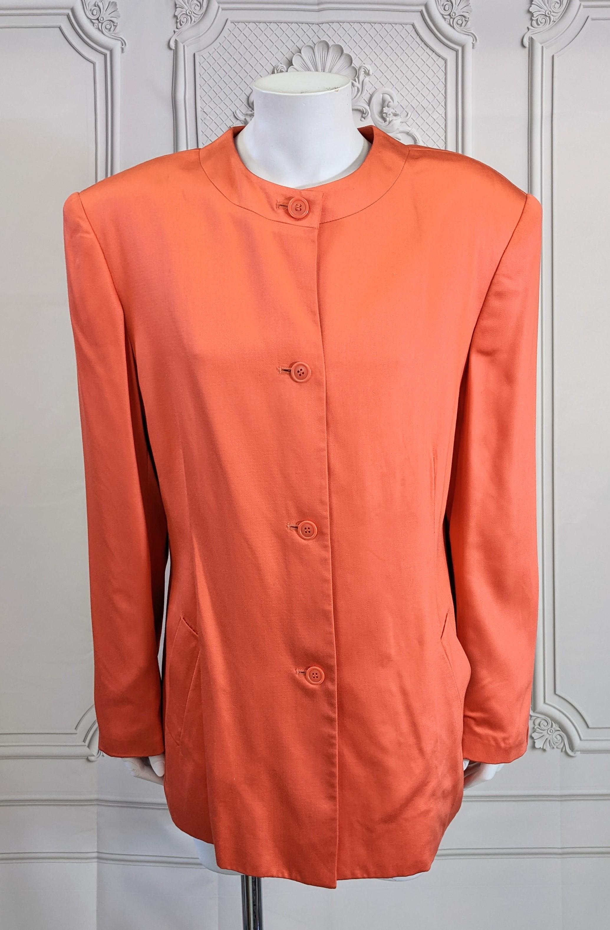 Stephen Sprouse Orange Twill Nehru style Jacket for one of his iconic monochromatic rocker suit looks. Soft rayon shiny satin twill is straight cut with front buttons, strong shoulders and slash pockets. Size 10 USA. 1980's. 
Probably shown with
