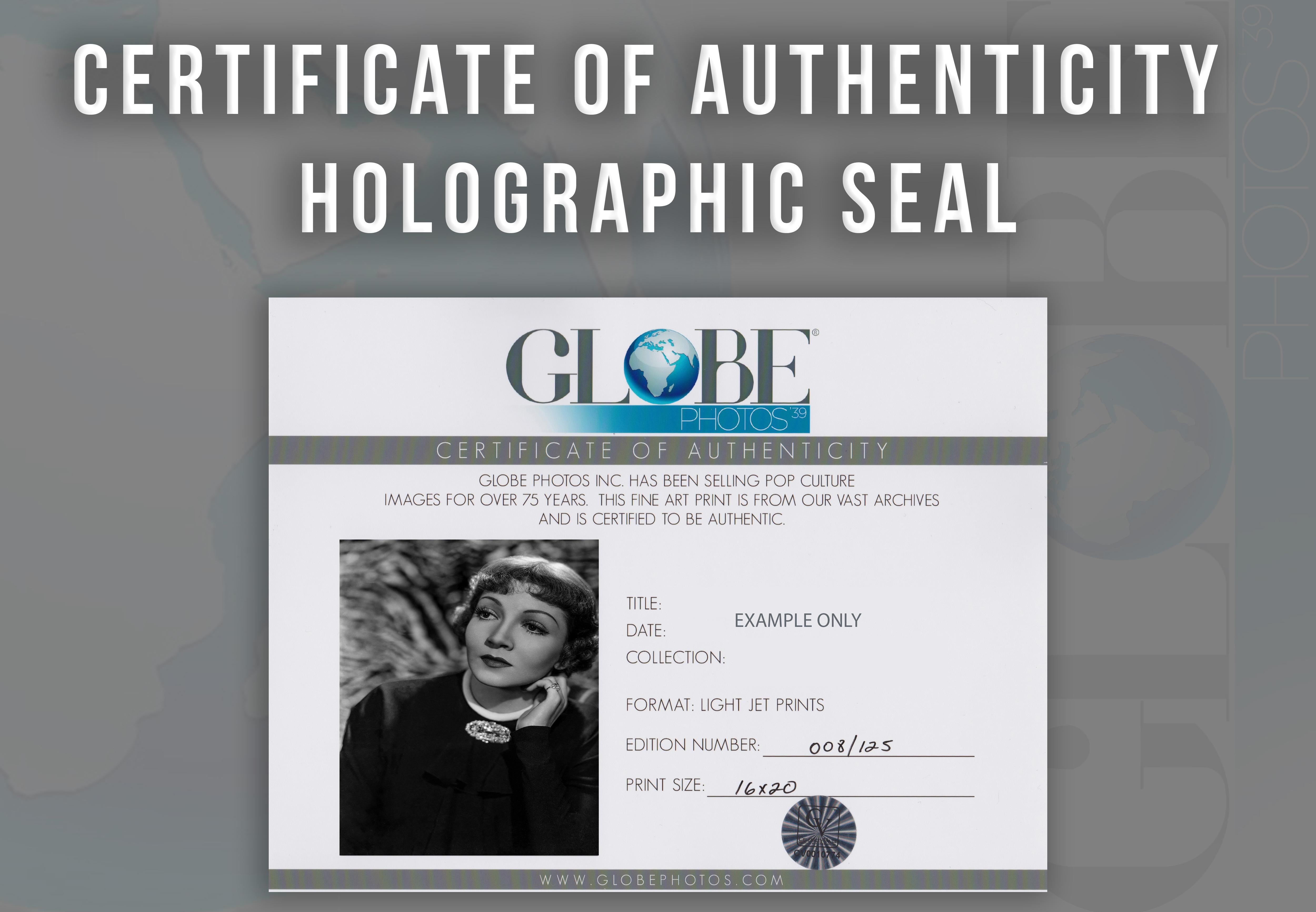 This black and white portrait features American film actress and a leading lady in Hollywood for over two decades, Claudette Colbert. Colbert is featured here posed deep in thought.

This image is credited to Globe Photos.

This is a limited edition