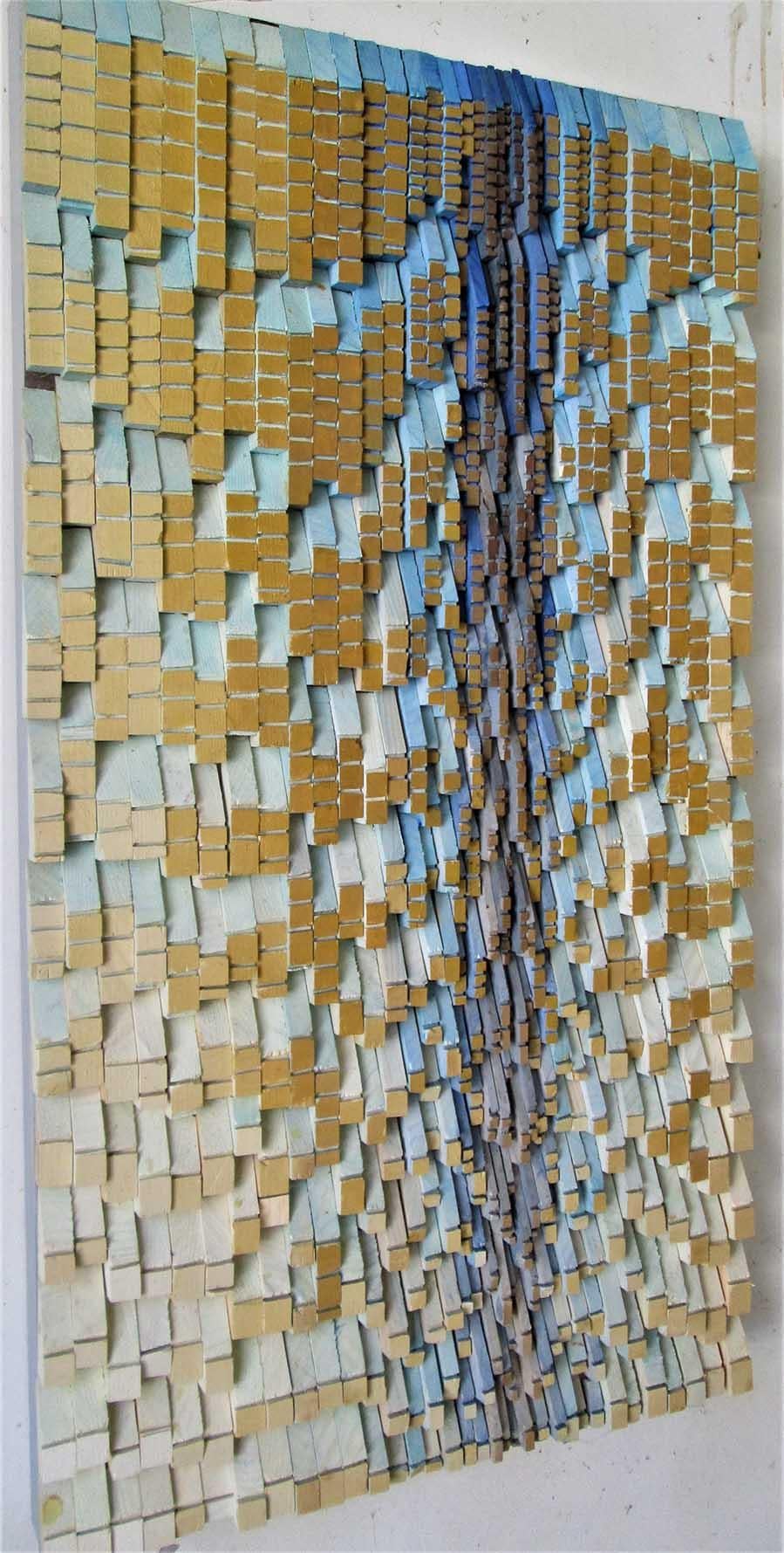 Abstract geometric three-dimensional wood wall sculpture in blue and neutral tones
