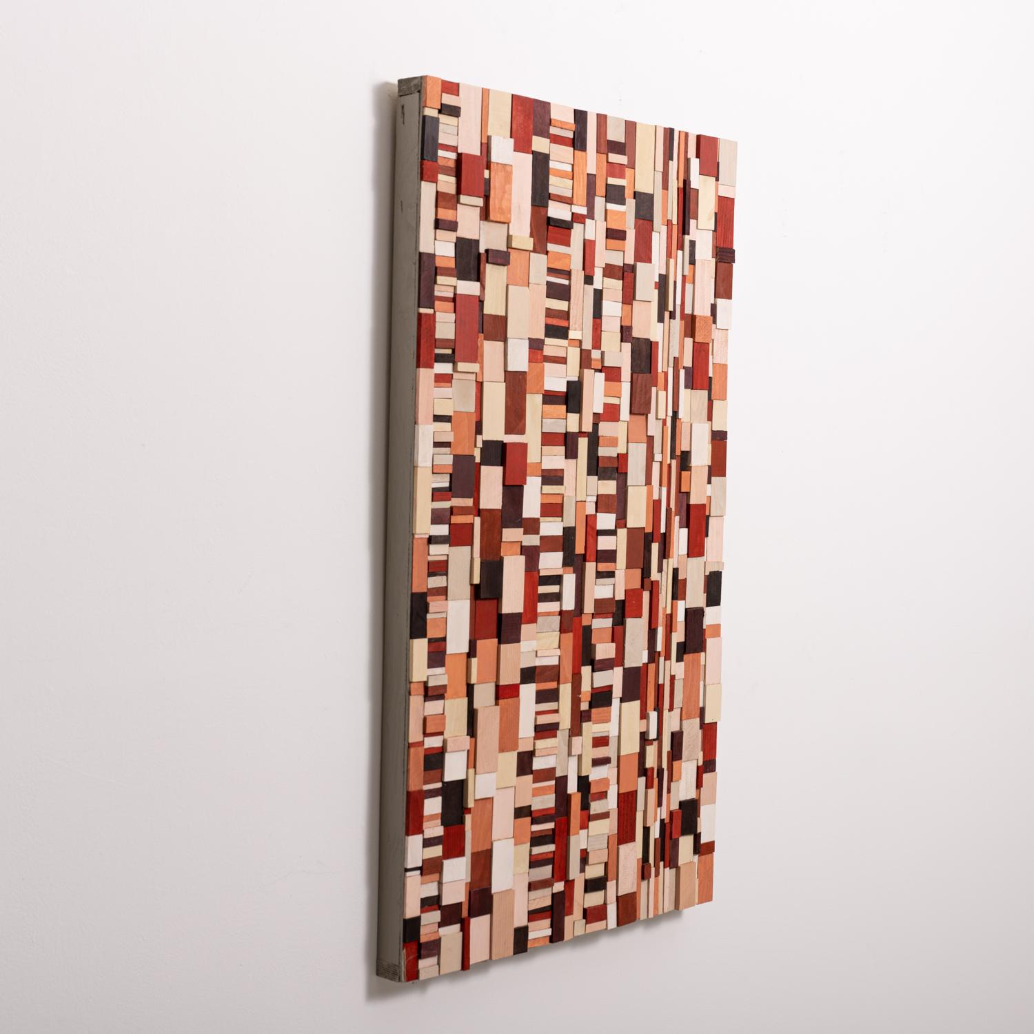 Abstract geometric three-dimensional wood wall sculpture in a rich palette of brick red, burgundy, and cream
