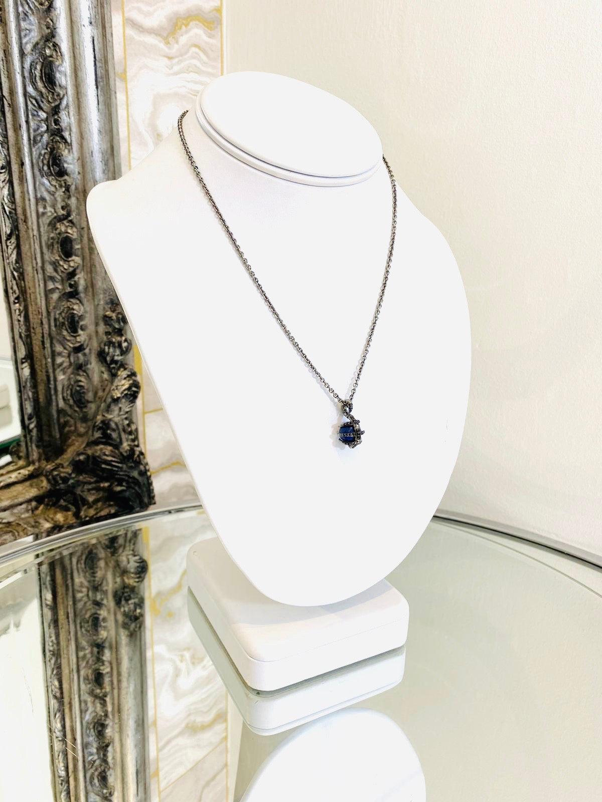 Stephen Webster 18k White Gold & Black Diamond Necklace

Stunning piece with bright blue sphere of Lapis Lazuli in a talon  pendant which is set with black diamonds.

Additional information:
Size – Chain Drop 21.5cm
Composition -  Diamonds, 18k