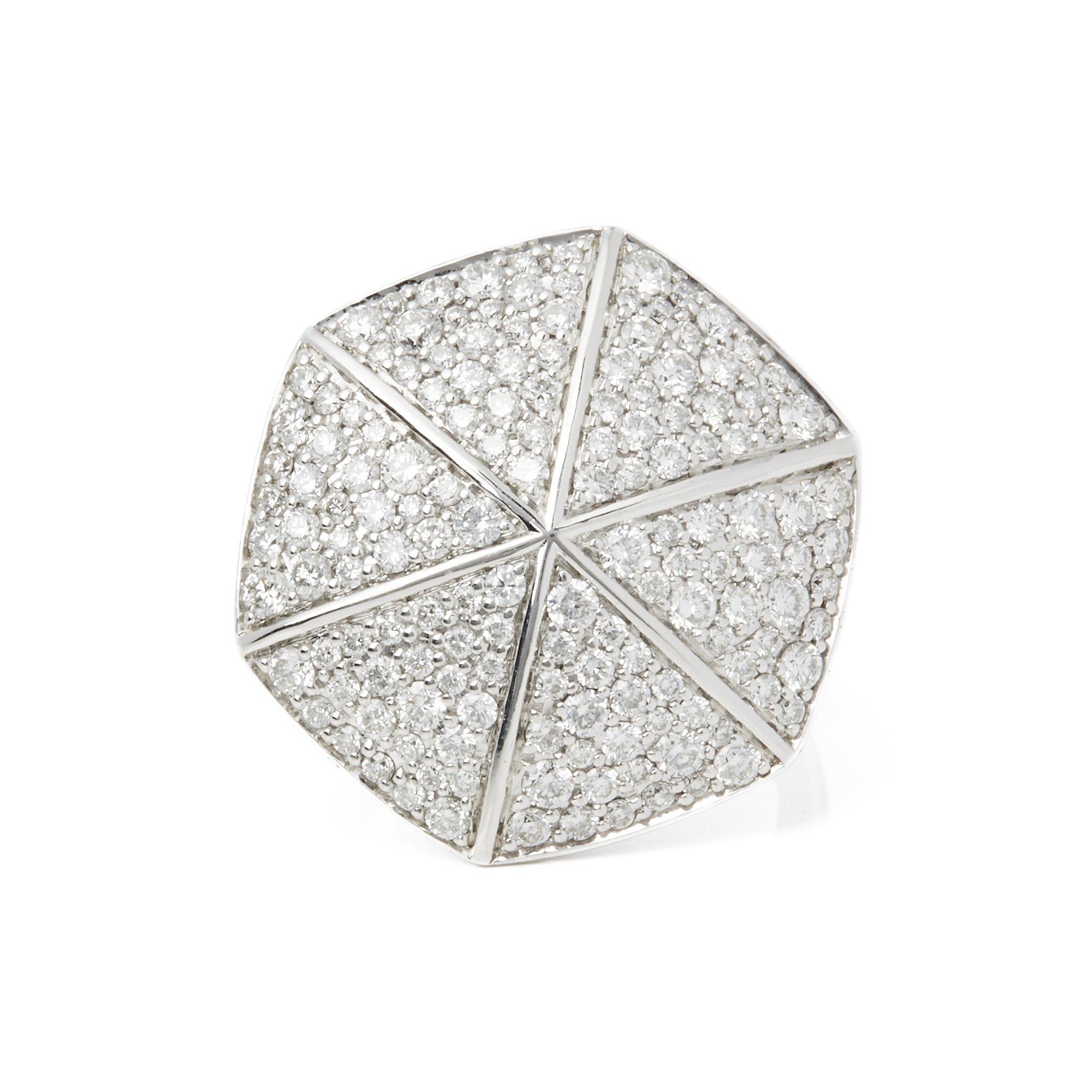 This Ring by Stephen Webster is from his Deco Collection and features Six Pave Round Briliant Diamond set sections with a total of One Hundred and Sixteen stones forming a Hexagonal shape. Set in 18k White Gold with Signature Stephen Webster