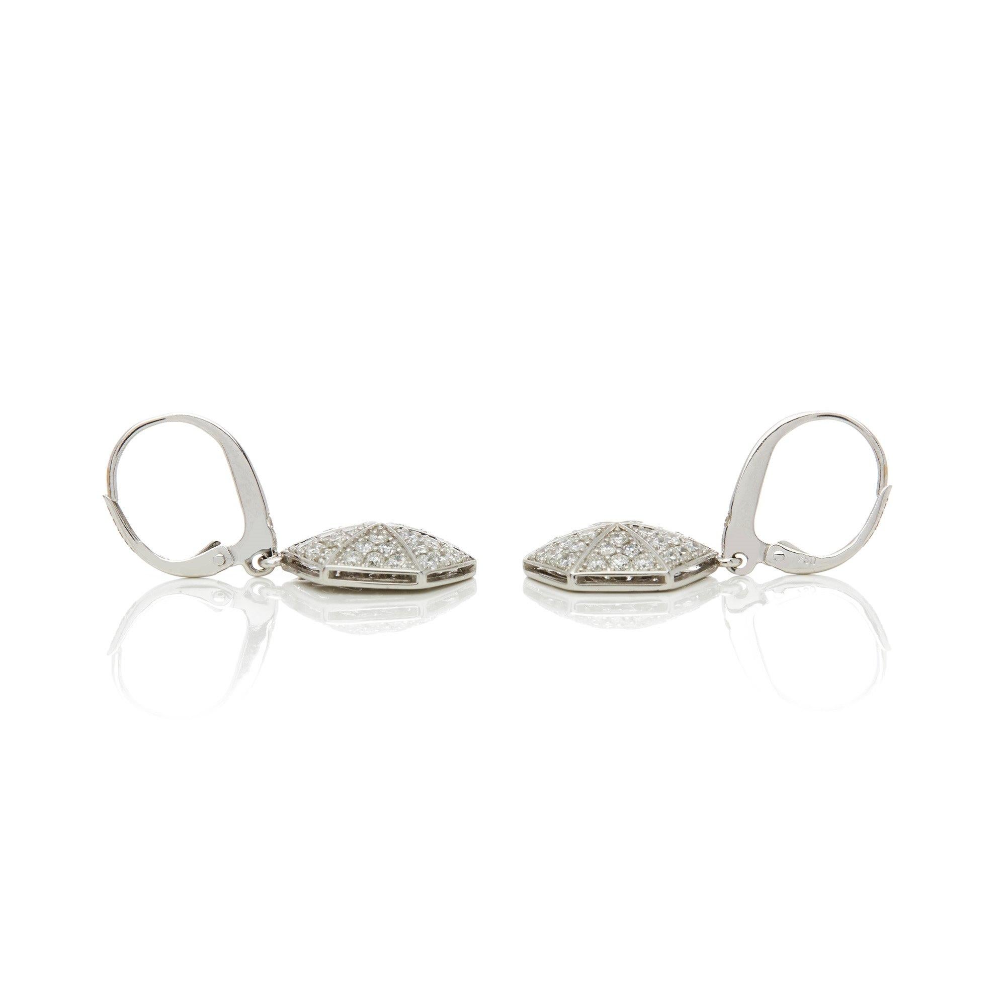 These Earrings by Stephen Webster are from his Deco Collection and features Six Pave Round Briliant Diamond set sections to each Earring with a total of Seventy Four stones forming a Hexagonal shape. Set in 18k White Gold with Articulated Lever Back