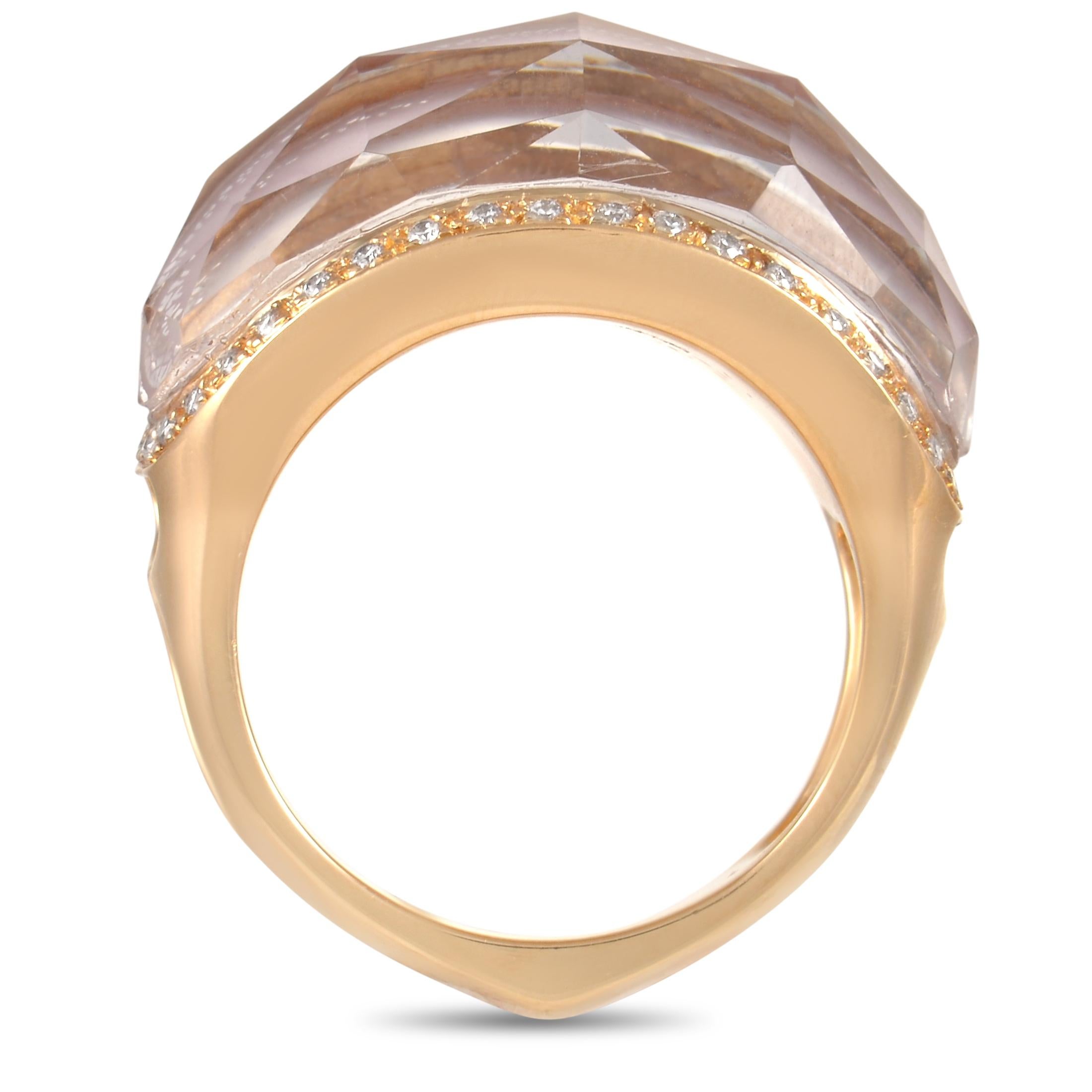 This luxury piece from Stephen Webster is decidedly on-trend. At the center of this piece’s 18K Yellow Gold setting, you’ll find a bold Crystal Haze Kunzite gemstone with a captivating pink hue. Diamonds totaling 0.50 carats add extra elegance to