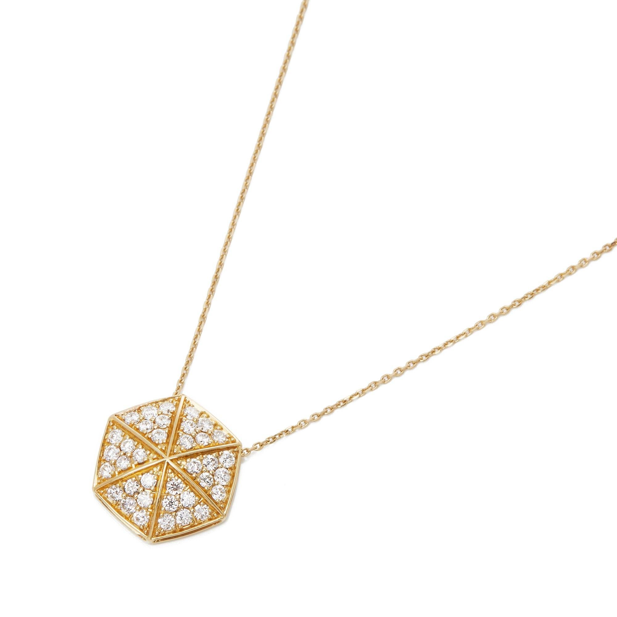 This Pendant by Stephen Webster is from his Deco Collection and features Six Pave Round Briliant Diamond set sections with a total of Thirty Six stones forming a Hexagonal shape. Set in 18k Yellow Gold with 41cm Trace Link Chain. Complete with Xupes