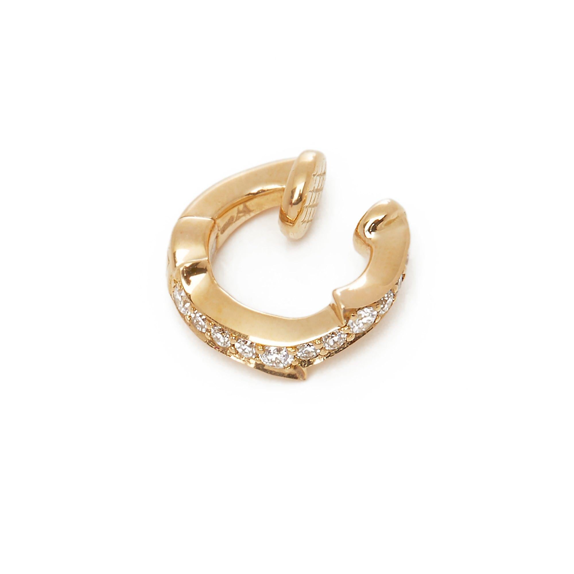 This Earclip by Stephen Webster is from his Thorn Collection and features Twelve Round Brilliant Diamonds Totalling 0.12cts. Set in 18k Yellow Gold. Complete with Xupes Presentation Box. Our Xupes reference is COMJ442 should you need to quote this.