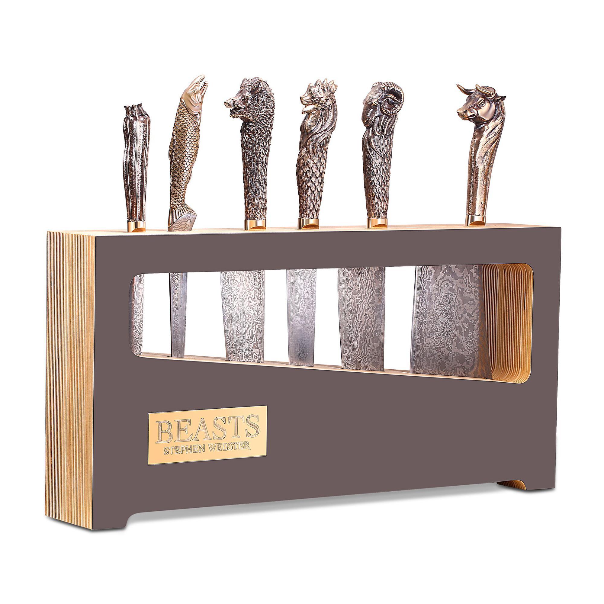 Beasts chef's knives, all with folded steel blades and bronze handles featuring a boar, a bull, a ram, a rooster, a sockeye salmon and a Courgette with knife block.

Please enquire for your exclusive price if your delivery country is outside of the