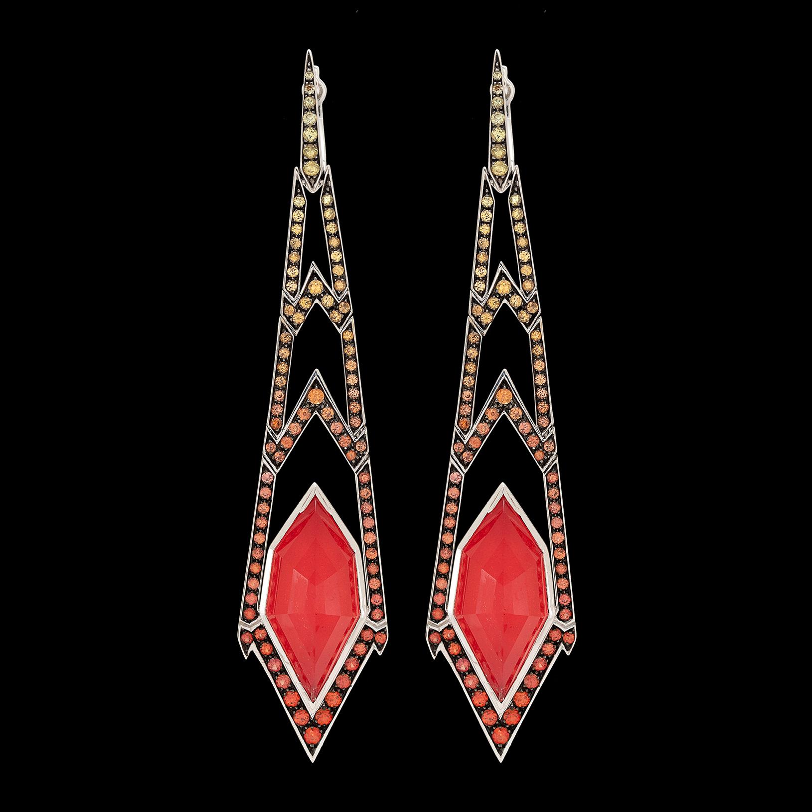 The colors of fall at their best in these Lady Stardust 18k white gold drop earrings by Stephen Webster. Highlighted by fancy-cut quartz over red coral, with yellow to orange sapphires set throughout. The earrings weigh 18.6 grams and measure 3in.
