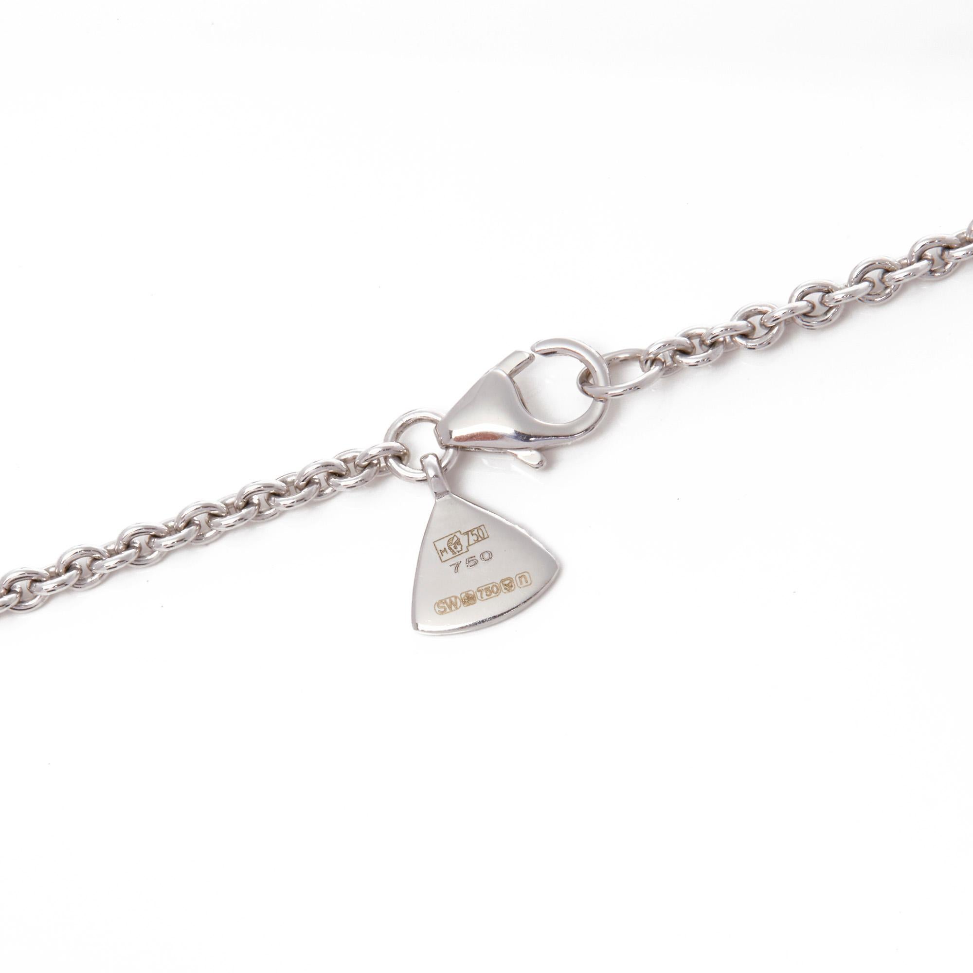This Pendant by Stephen Webster is from his Deco Haze Collection and features a Hematite Quartz Crystal Haze stone encased in a pave set white diamond setting. Set in White Gold and complemented by a White Gold trace chain. 