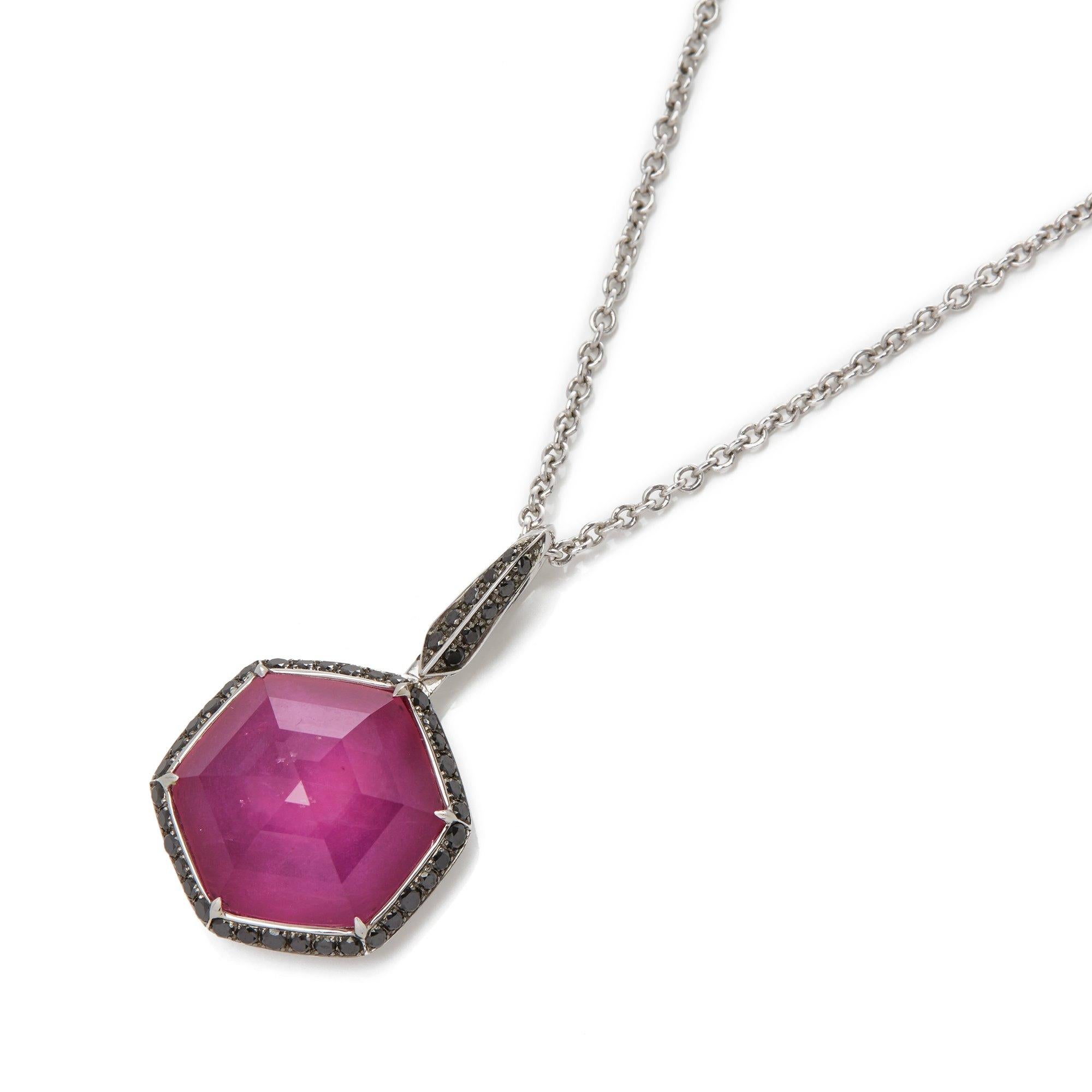 This pendant by Stephen Webster is from his Deco Haze Collection and features a ruby quartz measuring 10.43ct and black diamond pendant. Set in white gold and complemented by a white gold trace chain. 