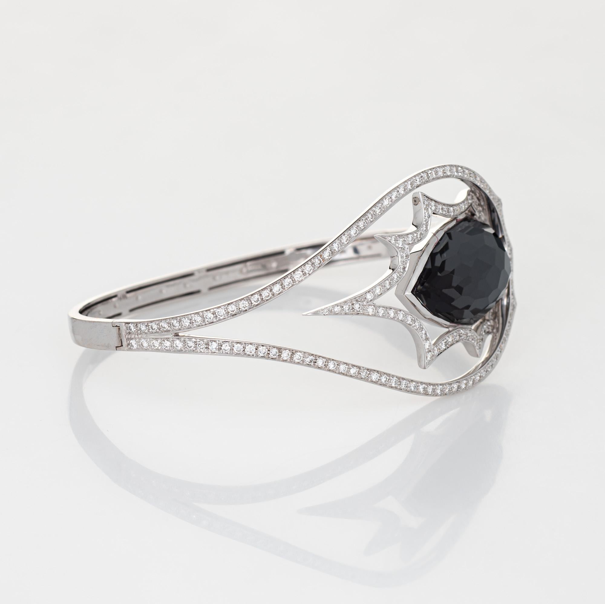 Stephen Webster cuff bracelet, crafted in 18 karat white gold.

Round brilliant cut diamonds total an estimated 1.75 carats (estimated at H-I color and VS2 clarity). Checkerboard faceted hematite measures 22mm x 13mm (in excellent condition and free
