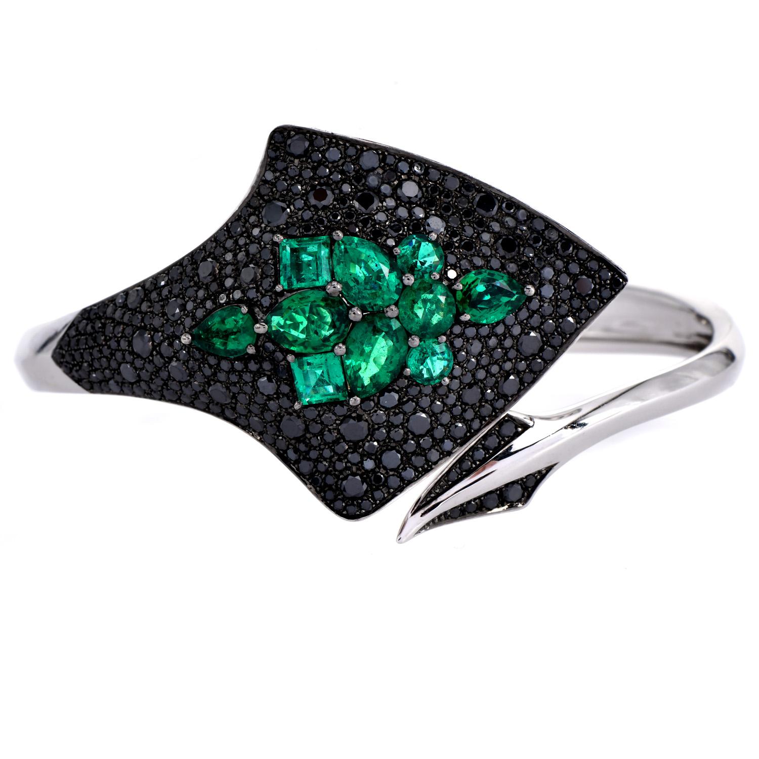 Stephen Webster's 18-carat White Gold Couture Stingray Cuff Bracelet.

Renowned for its exquisite craftsmanship and creativity. Impeccably designed with a harmonious blend of black and white diamonds along with vibrant green emeralds. 

The bracelet